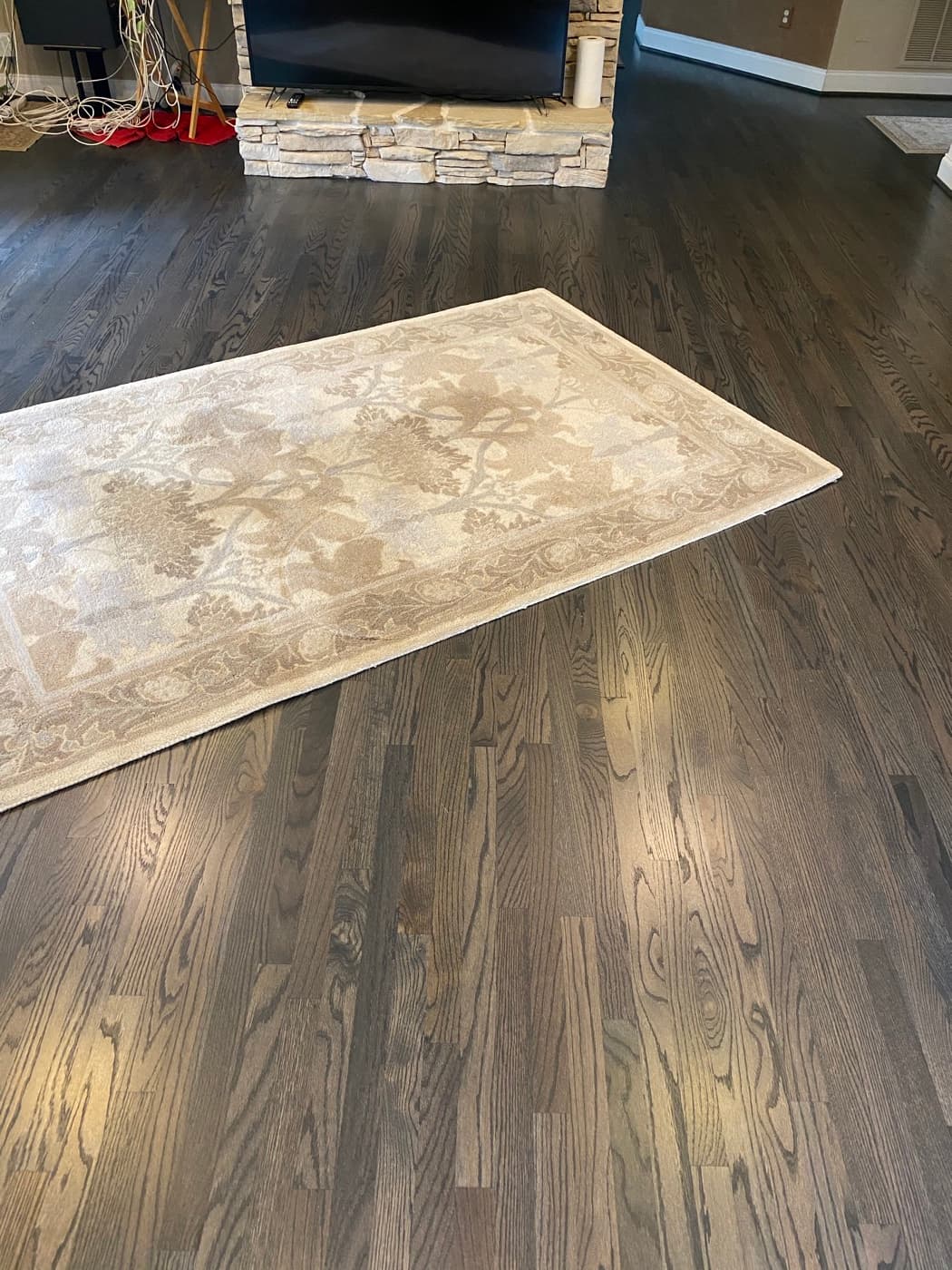 Red oak hardwood floor in Bona Driftwood stain with satin finish in a Fuquay-Varina NC living room, a durable low-sheen setup for a dog household