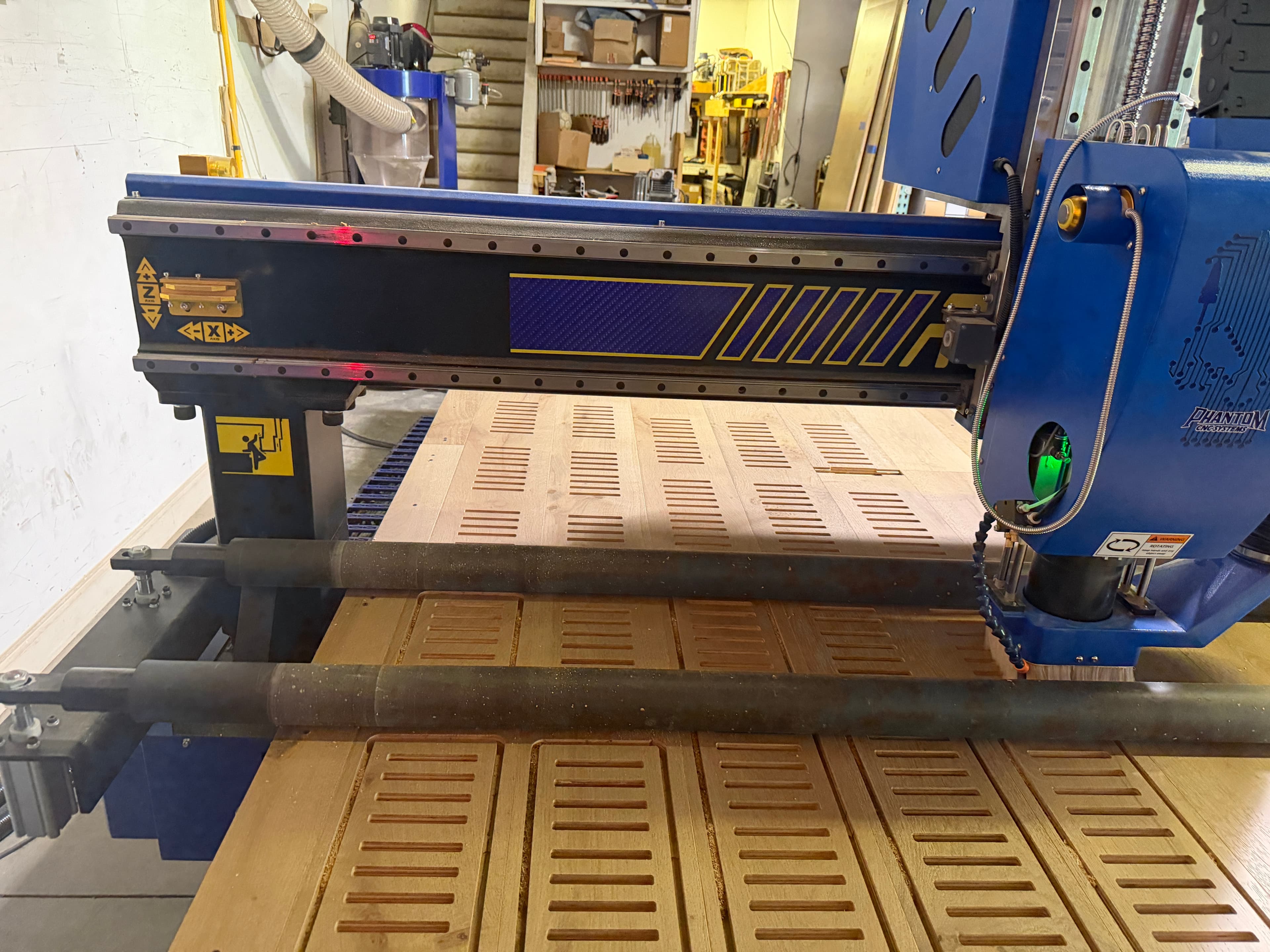 Phantom CNC router cutting custom flush mount hardwood floor vents in Clayton NC shop