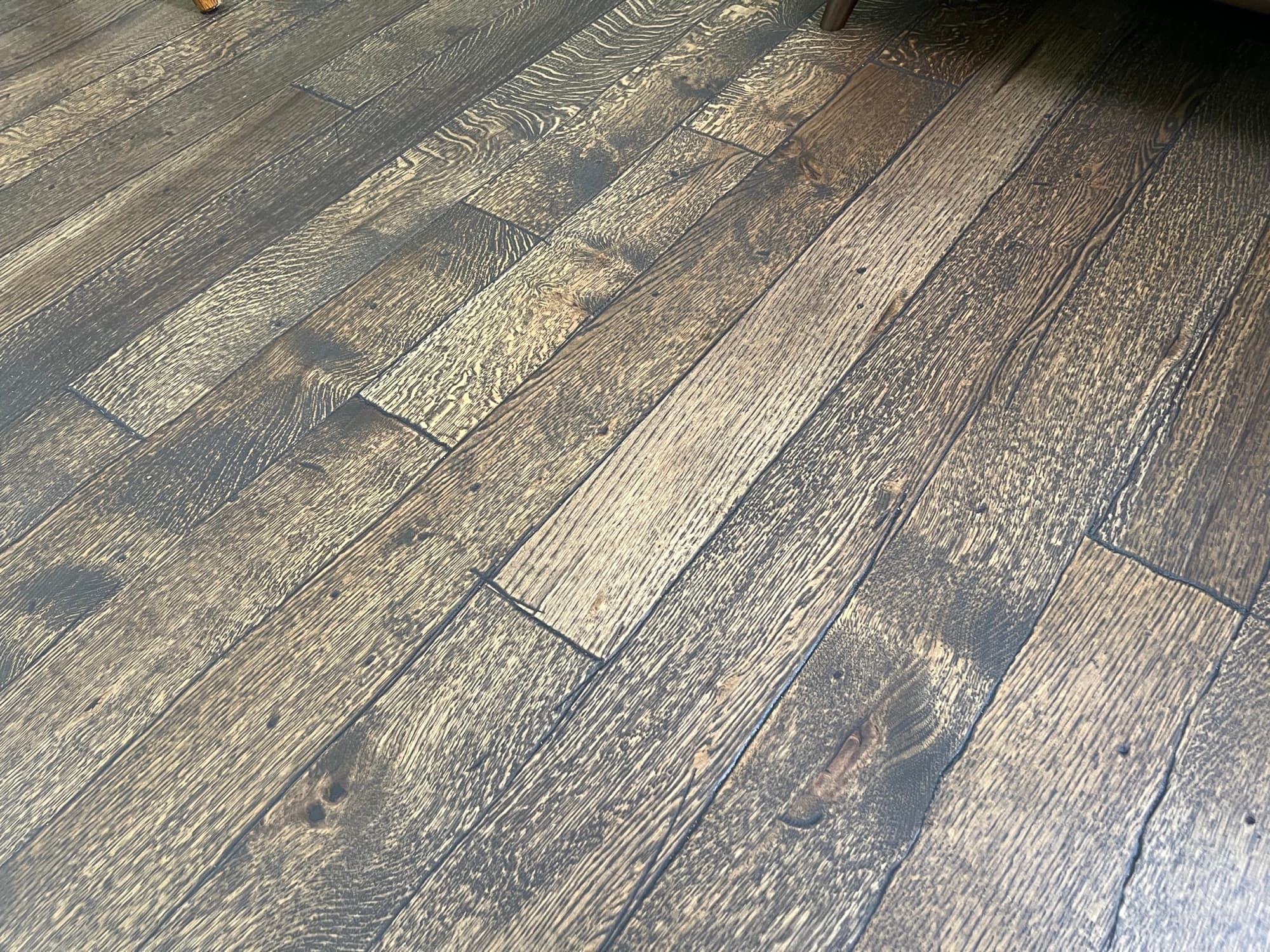 Dark stained wire-brushed white oak hardwood floors installed and finished in Fuquay-Varina, NC