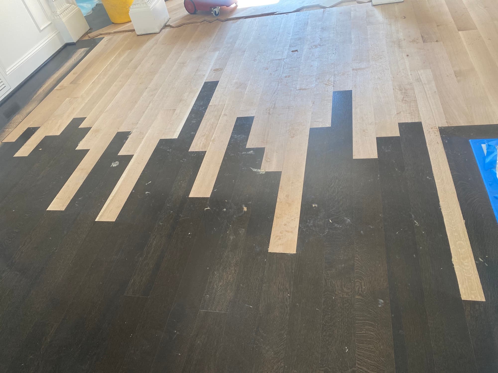 Completed hardwood floor lace-in repair after water damage in Raleigh NC by 12th And Oak Floor Co.