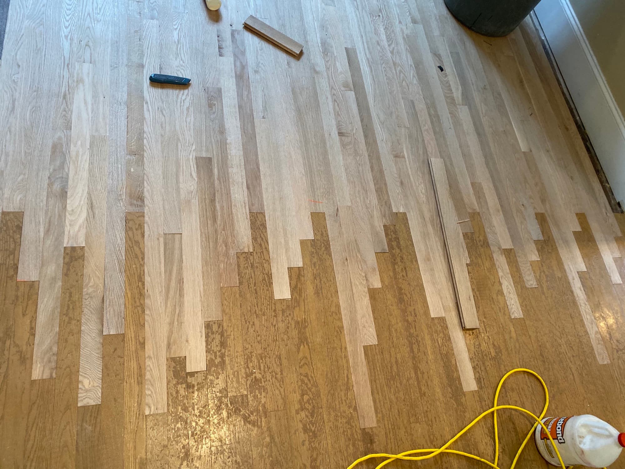 Hardwood floor lace-in repair in progress red oak