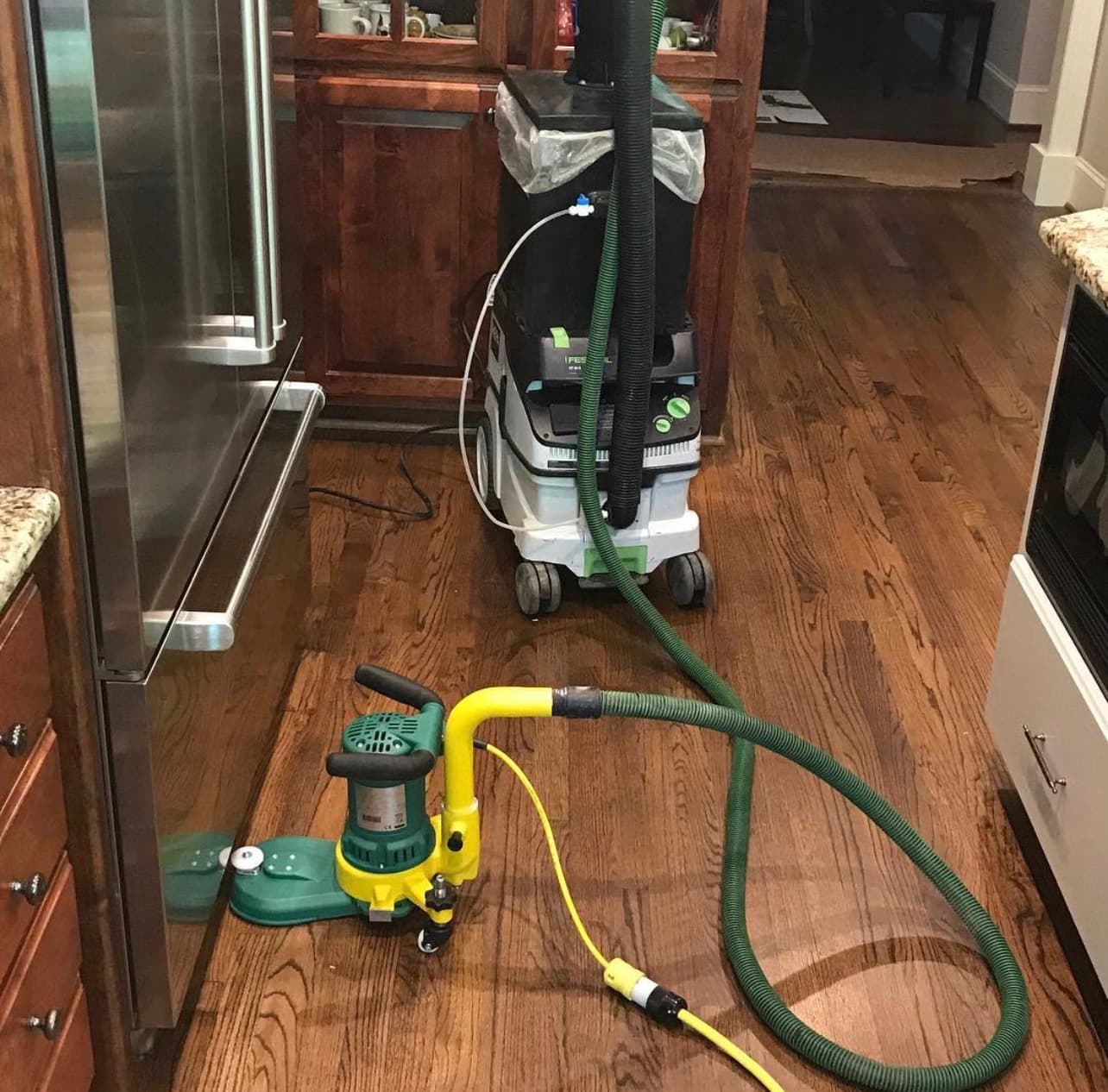 Lagler edge sander with Festool HEPA vacuum dust containment hardwood floor sanding