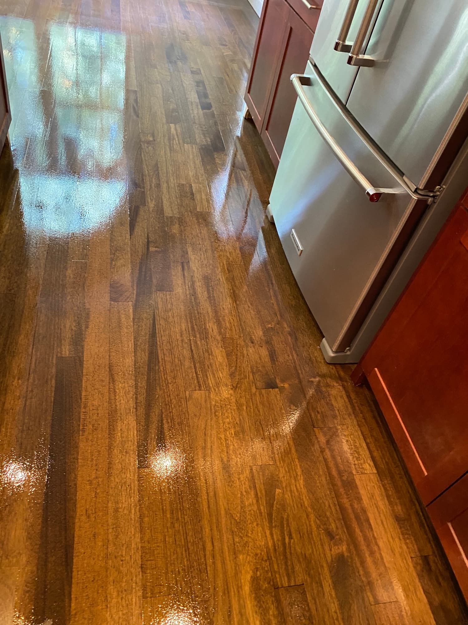 Refinished Brazilian oak floors after water damage repair in McGregor Downs Cary NC, custom Bona stain with Bona Traffic HD finish