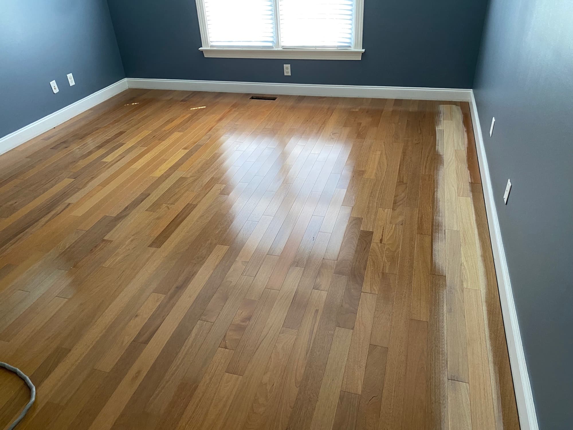 Sanding Brazilian oak floor with big machine after lace-in repair in Cary NC