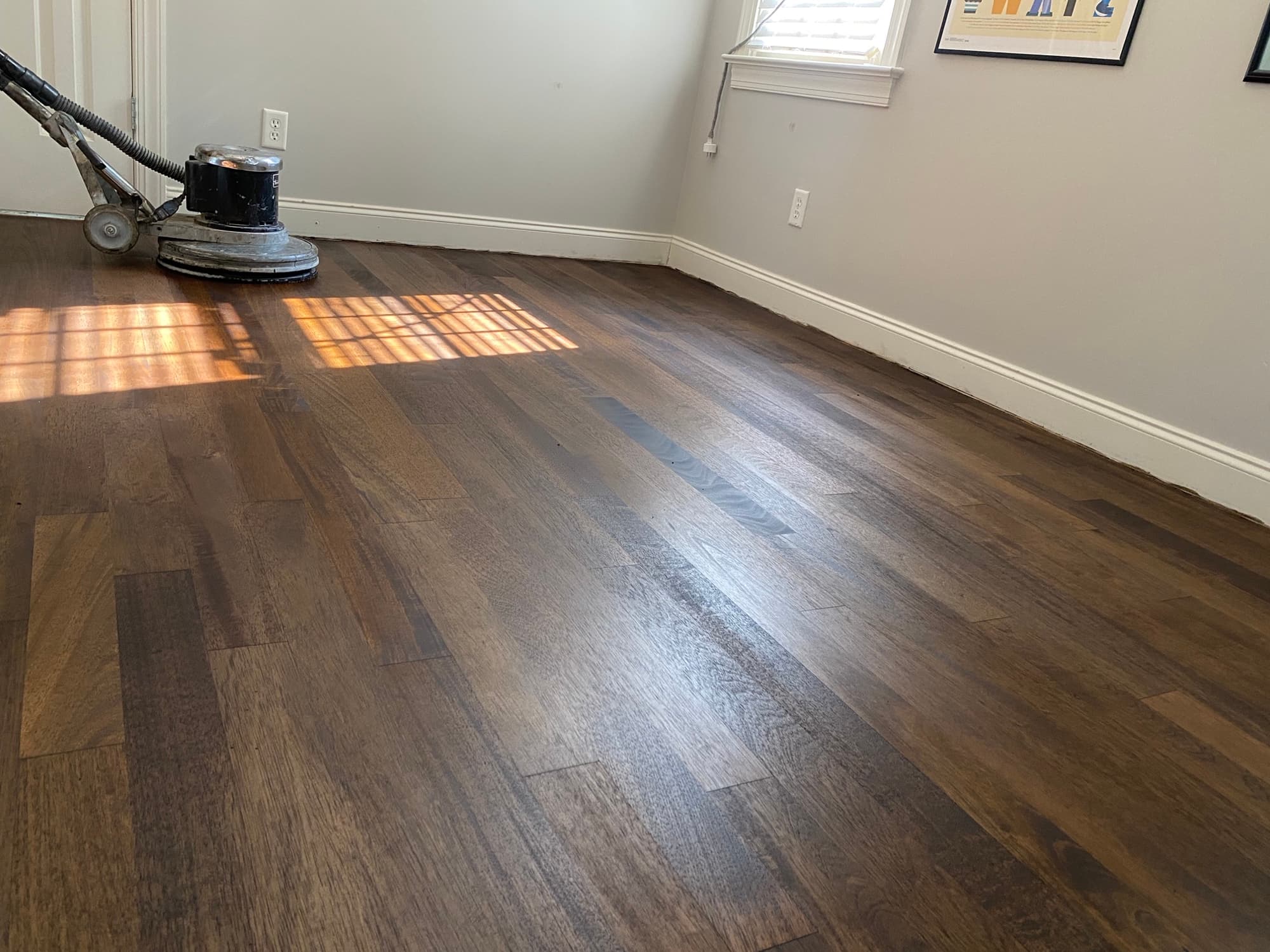 Second pass of Bona stain application on Brazilian oak floors in Cary NC