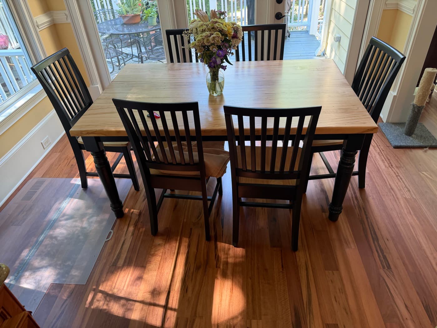 Breakfast room with refinished Brazilian Tigerwood floor and dining table in Glen Laurel Clayton NC