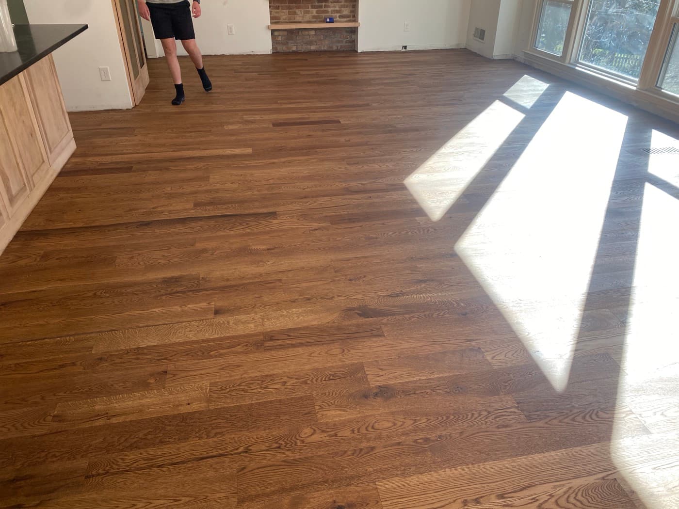 Finished 5-inch engineered white oak with custom Pallmann Magic Oil in open plan kitchen and living area Oak Park Raleigh NC