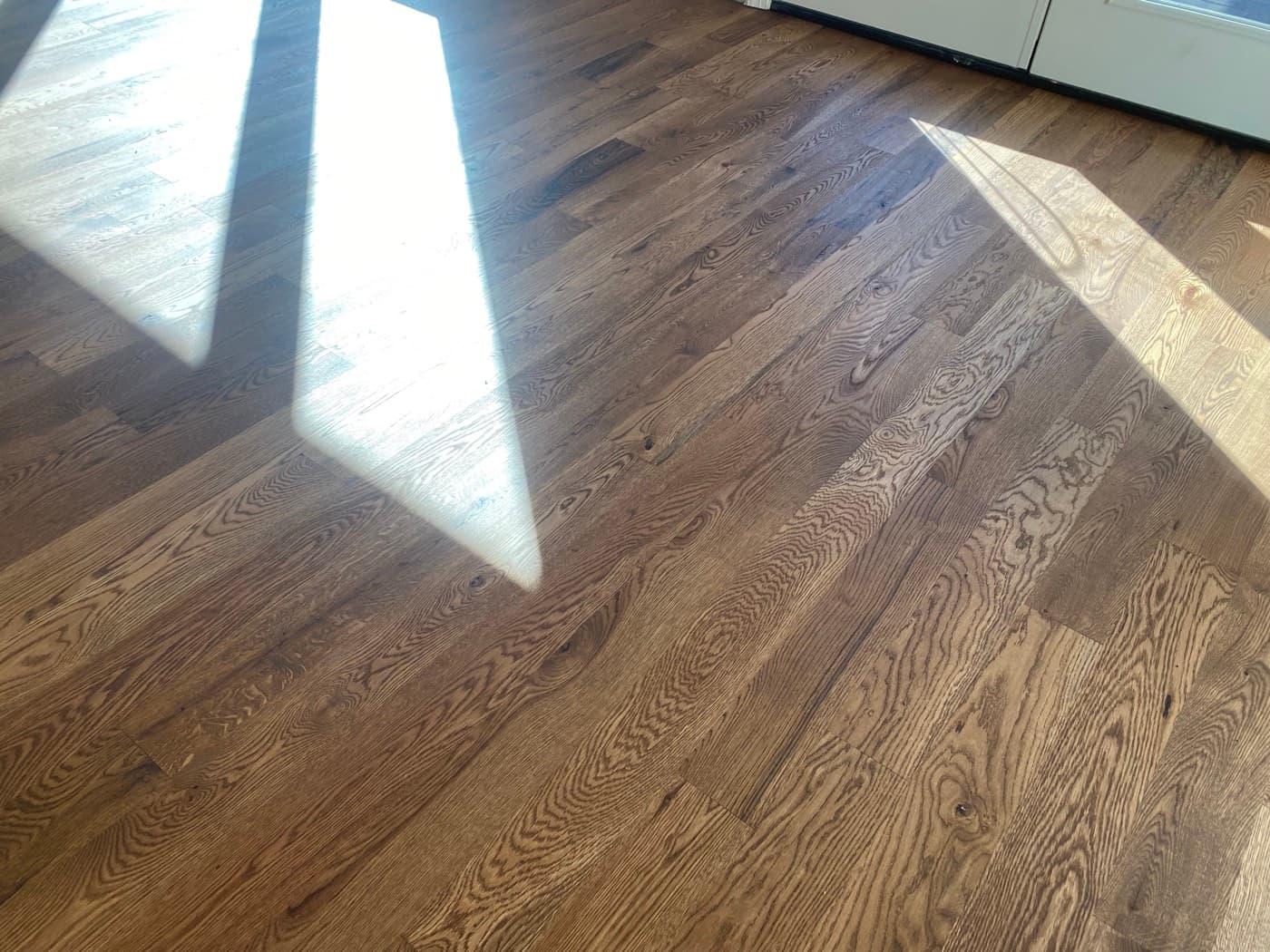 Close-up grain detail of finished custom Pallmann Magic Oil on 5-inch white oak showing buttery smooth surface and ray fleck Oak Park Raleigh NC