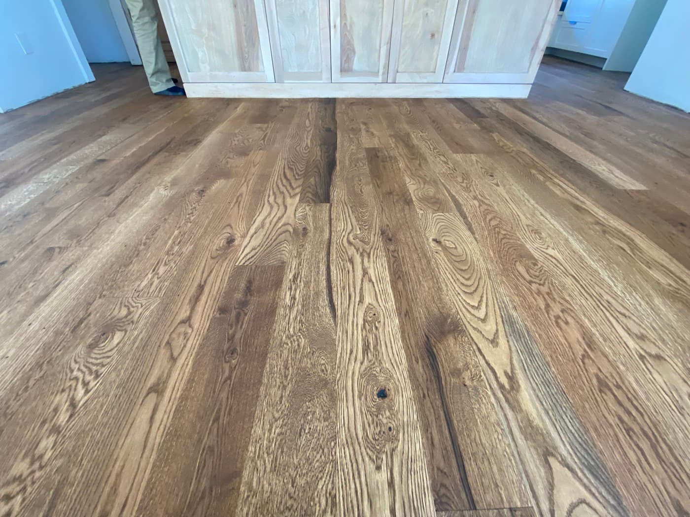 Finished Pallmann Magic Oil white oak floor grain close-up near custom cabinetry in Oak Park Raleigh NC