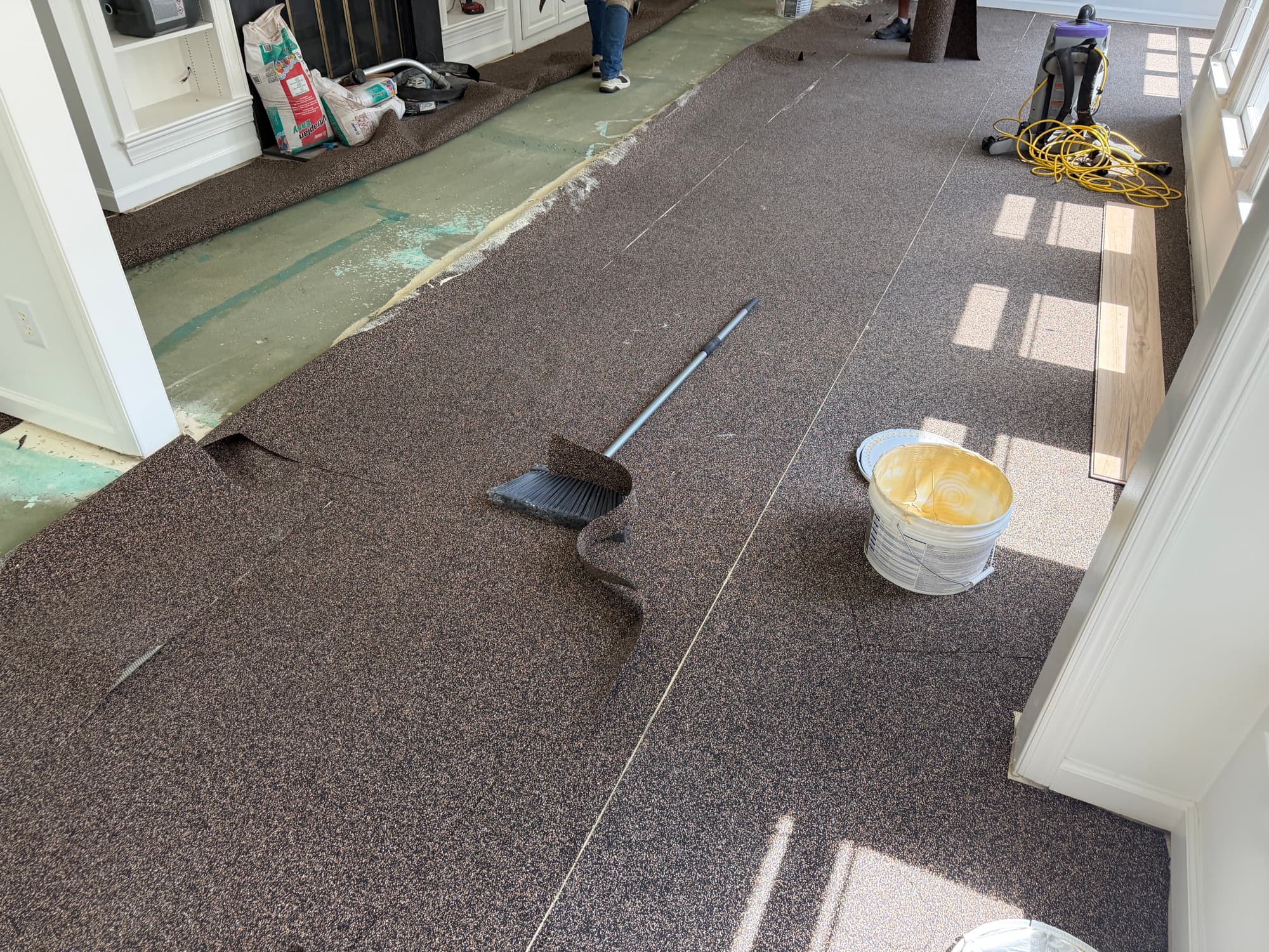 Wakol TS 102 sound dampening underlayment glued to concrete slab in living room