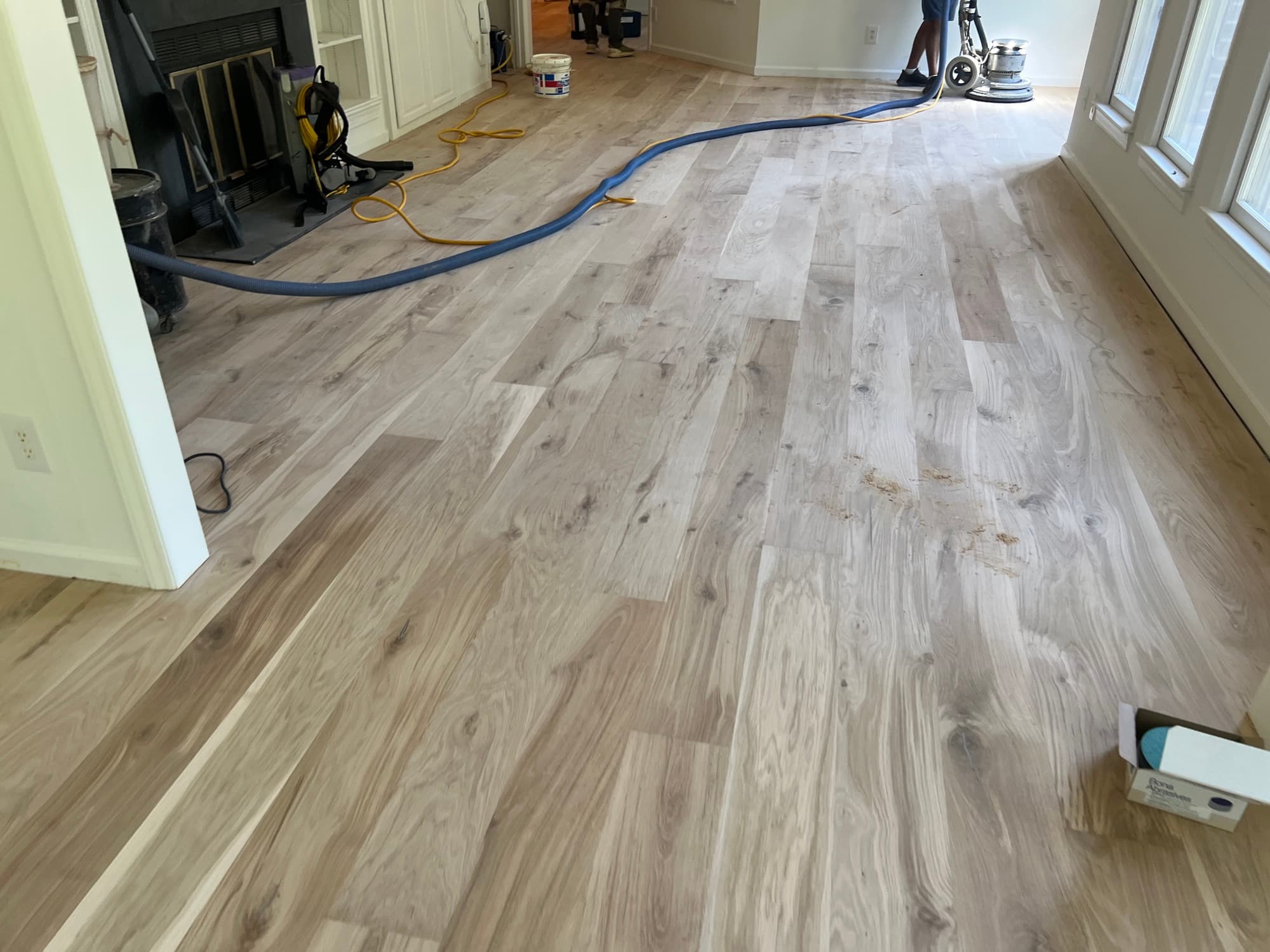 Bona PowerDrive planetary sander flattening newly installed European white oak floor