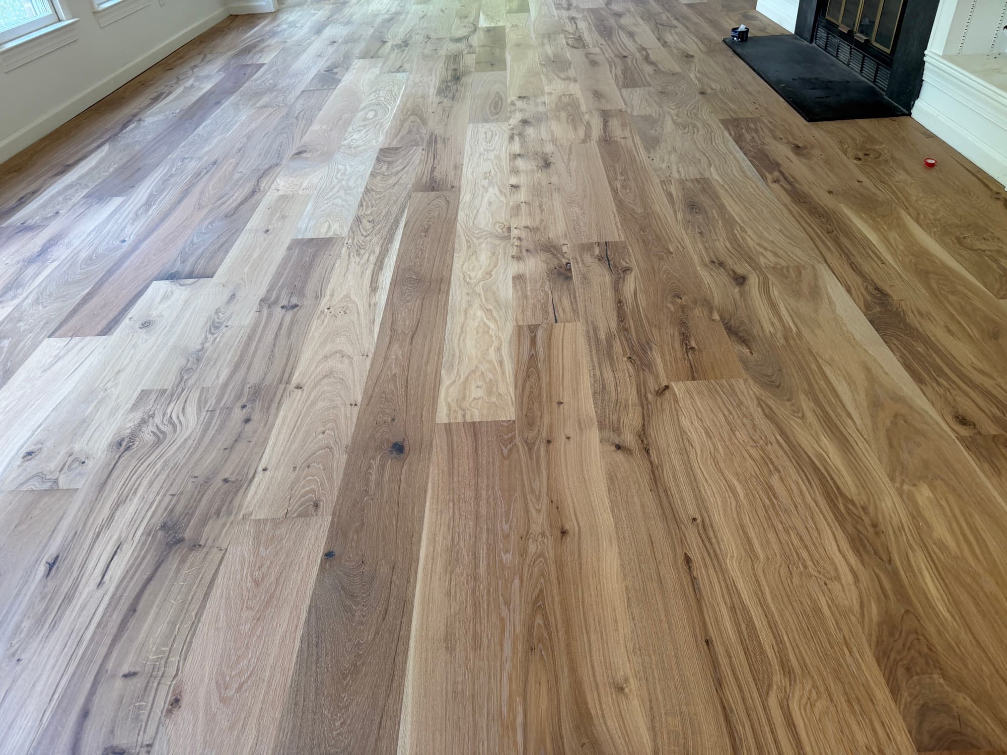 Character European white oak flooring at fireplace with natural hardwax oil finish