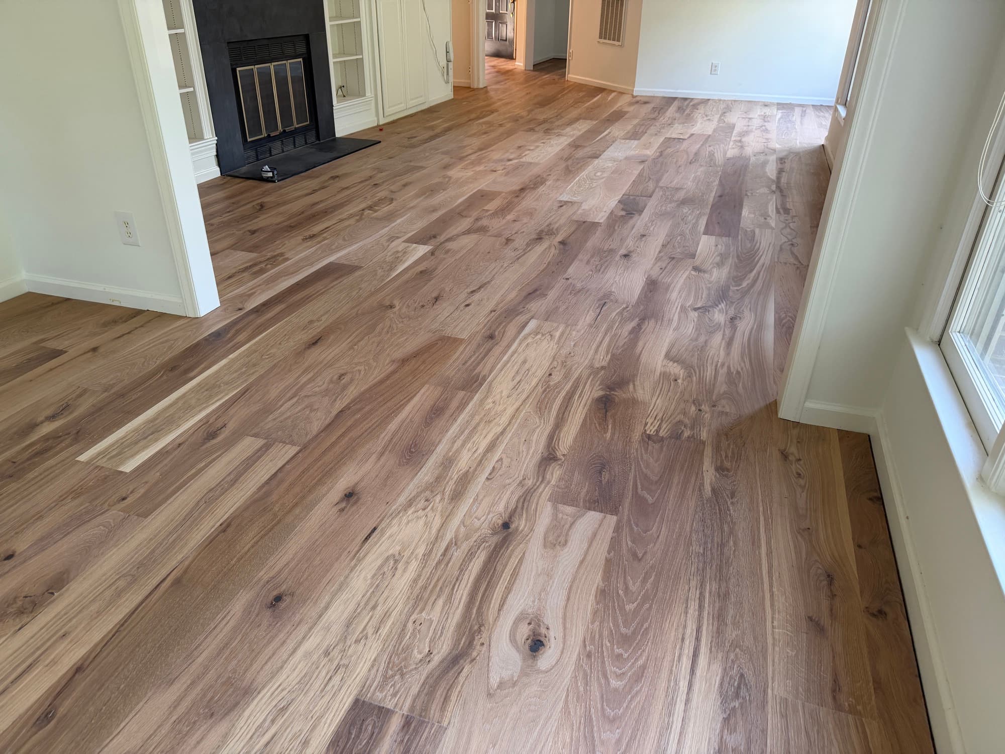 Finished 7.5 inch character European white oak floor with custom blend Natura hardwax oil in a Downtown Raleigh home off Glenwood Avenue