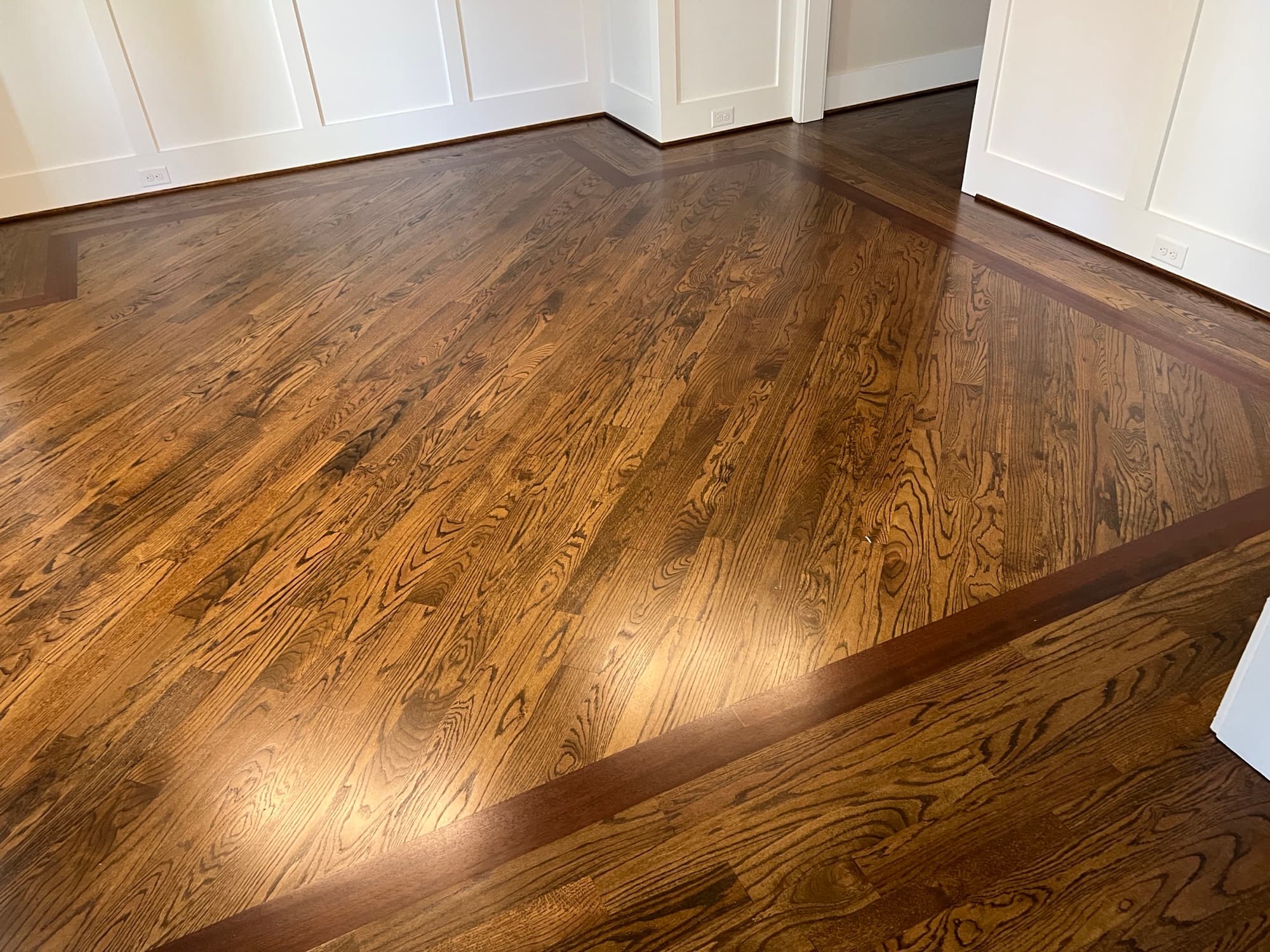 Finished red oak floors with Brazilian Cherry border in Flowers Plantation Clayton NC, DuraSeal Medium Brown Bona Traffic Satin