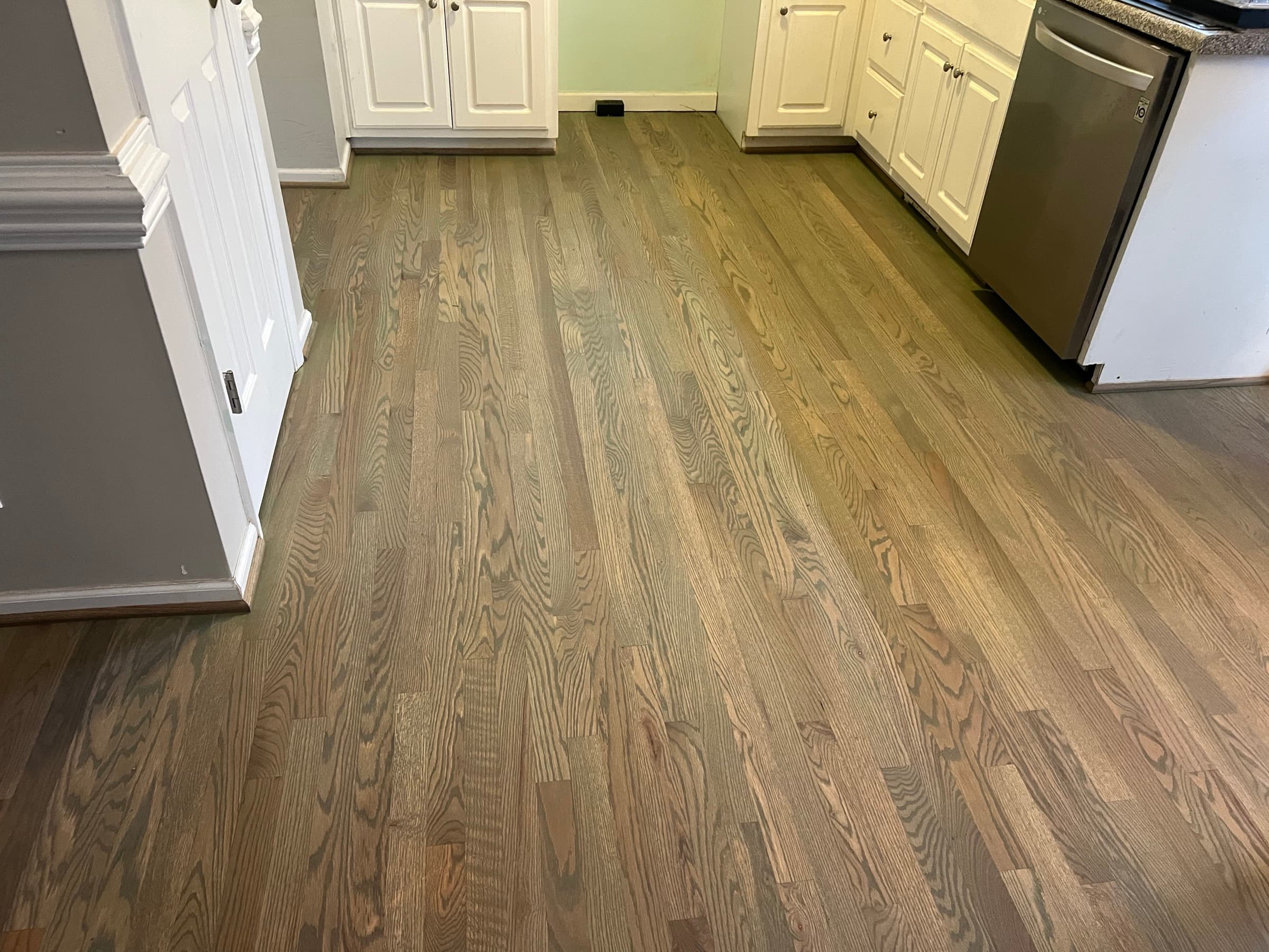 Red oak hardwood floor repaired and finished with custom olive brown velvet matte hardwax oil blend in Matthews Farm Clayton NC