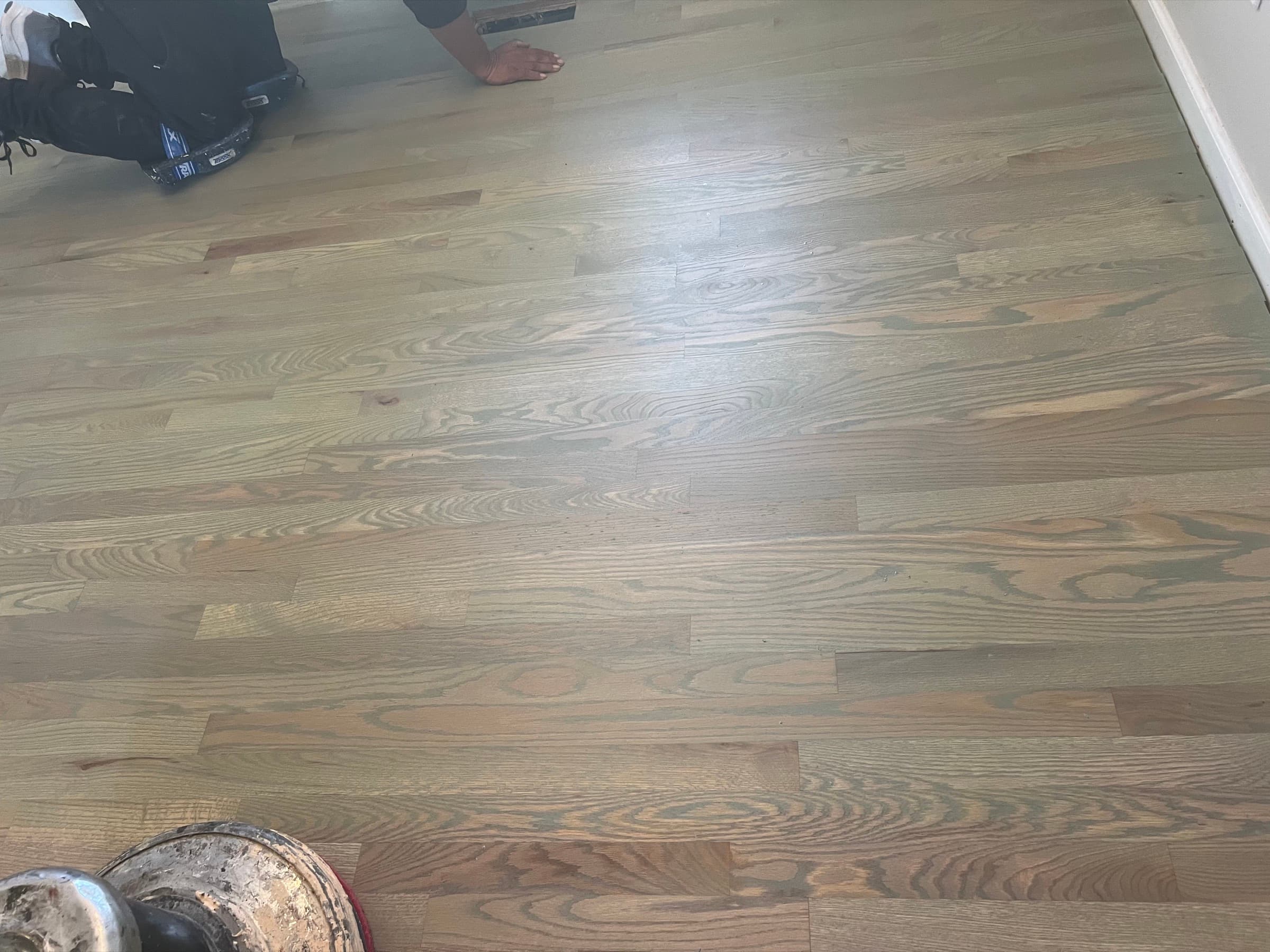 Full kitchen view of finished red oak floor with custom olive brown hardwax oil blend in Matthews Farm Clayton NC