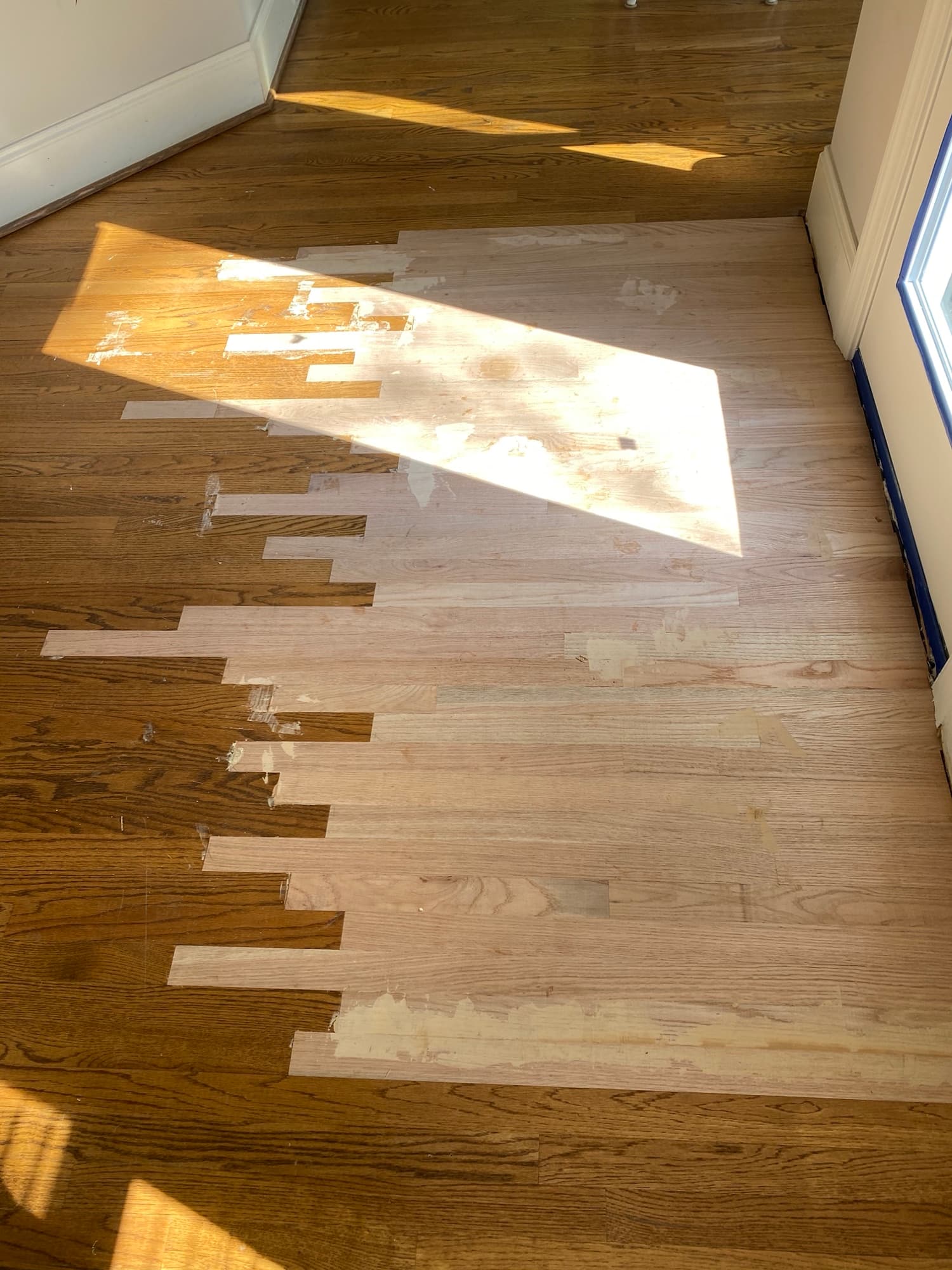 Repair area installation complete in Hocutt Farm Clayton NC, new red oak boards fully installed matching existing floor