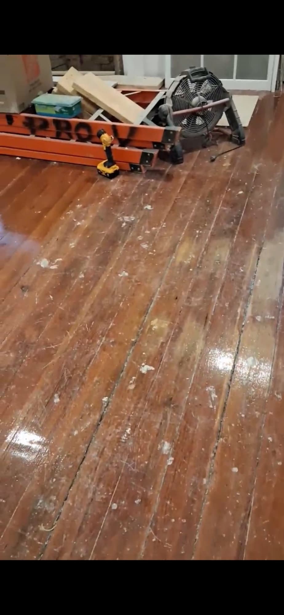 Historic heart pine floors before refinishing in Morrisville NC, original worn finish on wide plank 100-year-old pine with Lagler drum sander staged