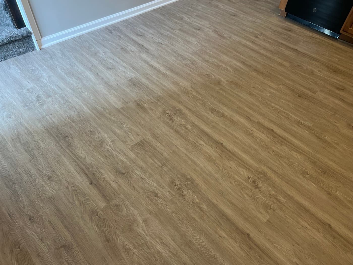 Finished LVP flooring in secondary room of Miriah Towns townhouse, Garner NC