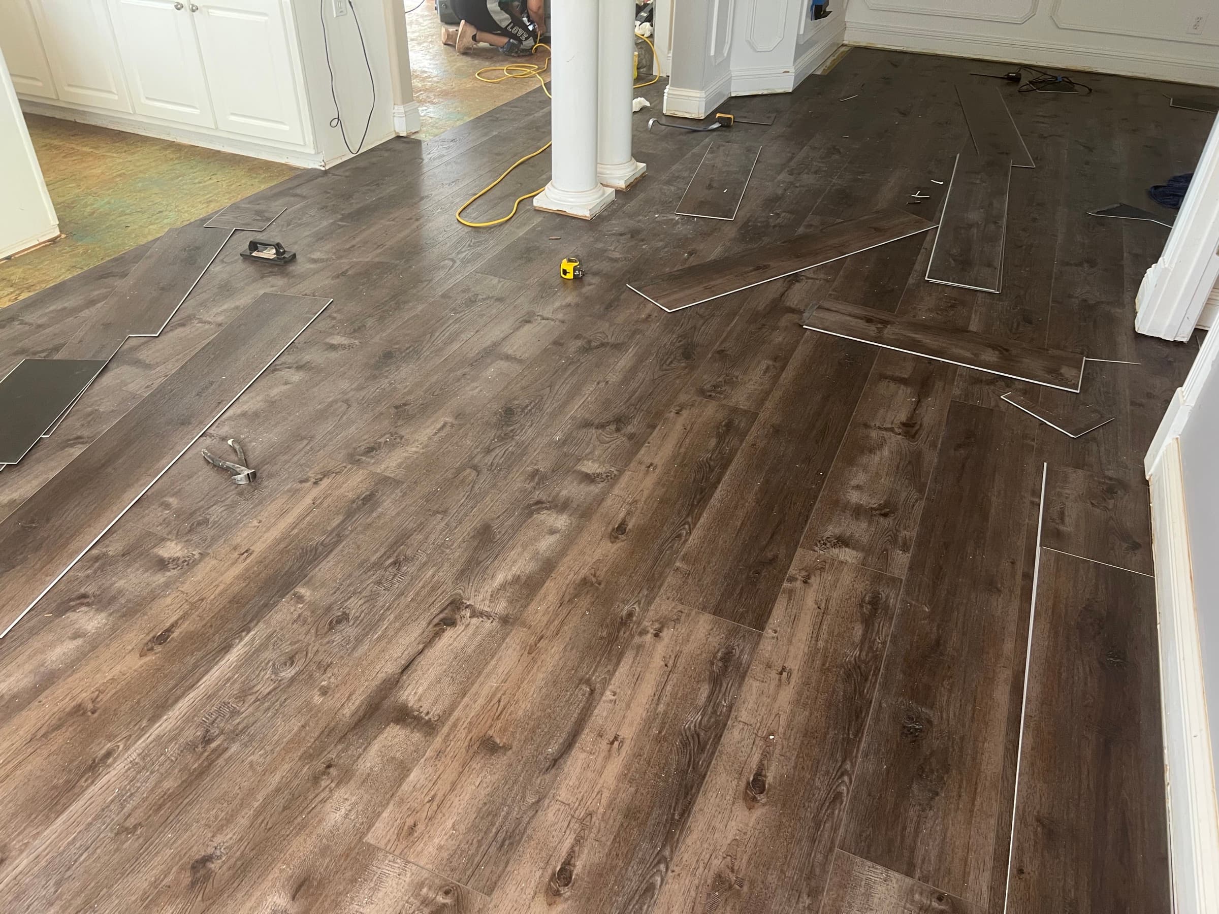 Innova SPC Pearl River installation in progress in Winston Plantation Clayton NC open concept living area with columns