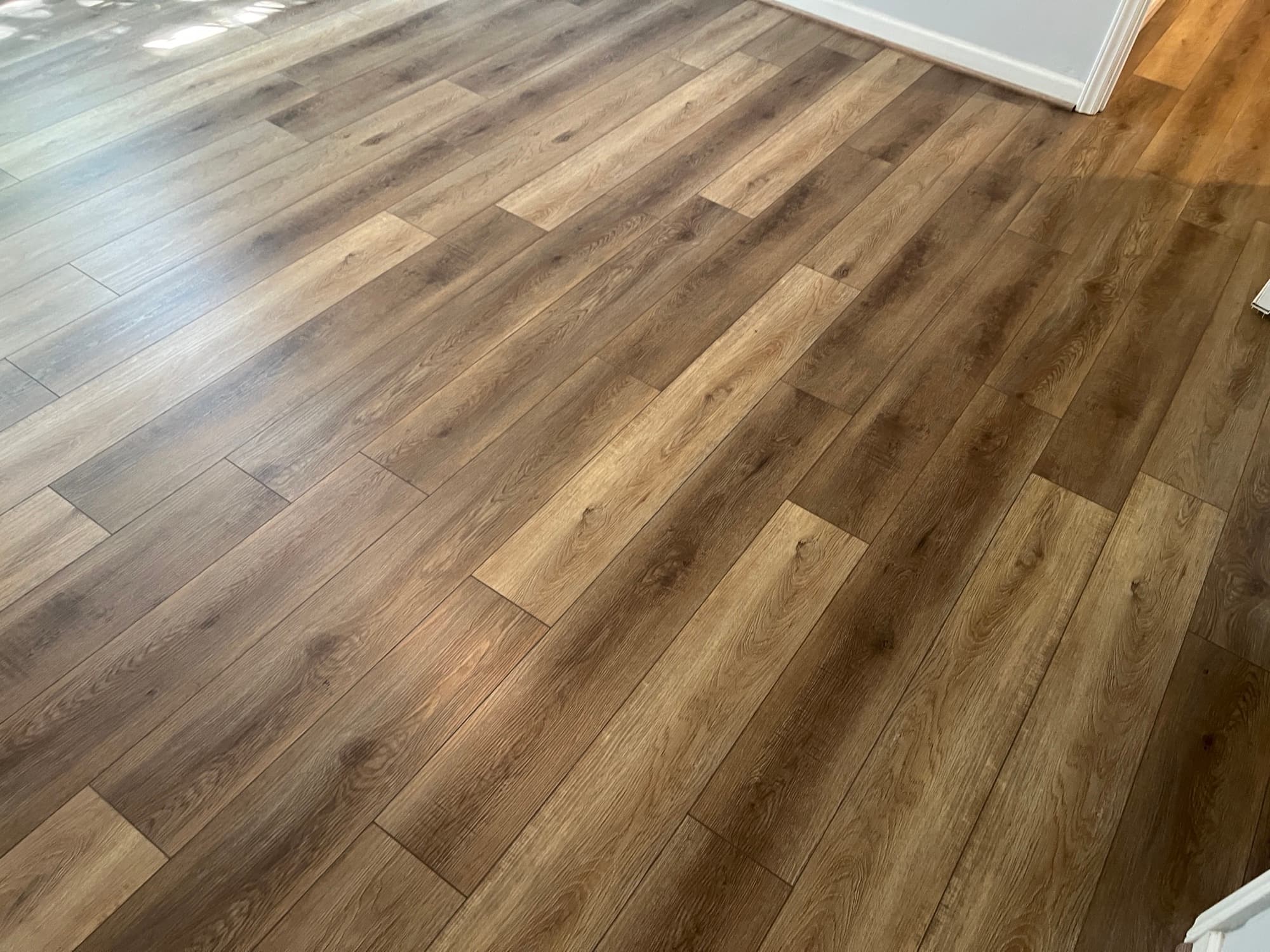 Finished Choice Flooring LVP Vineyard Chardonnay in natural light in Zebulon NC home after mold remediation and crawl space encapsulation