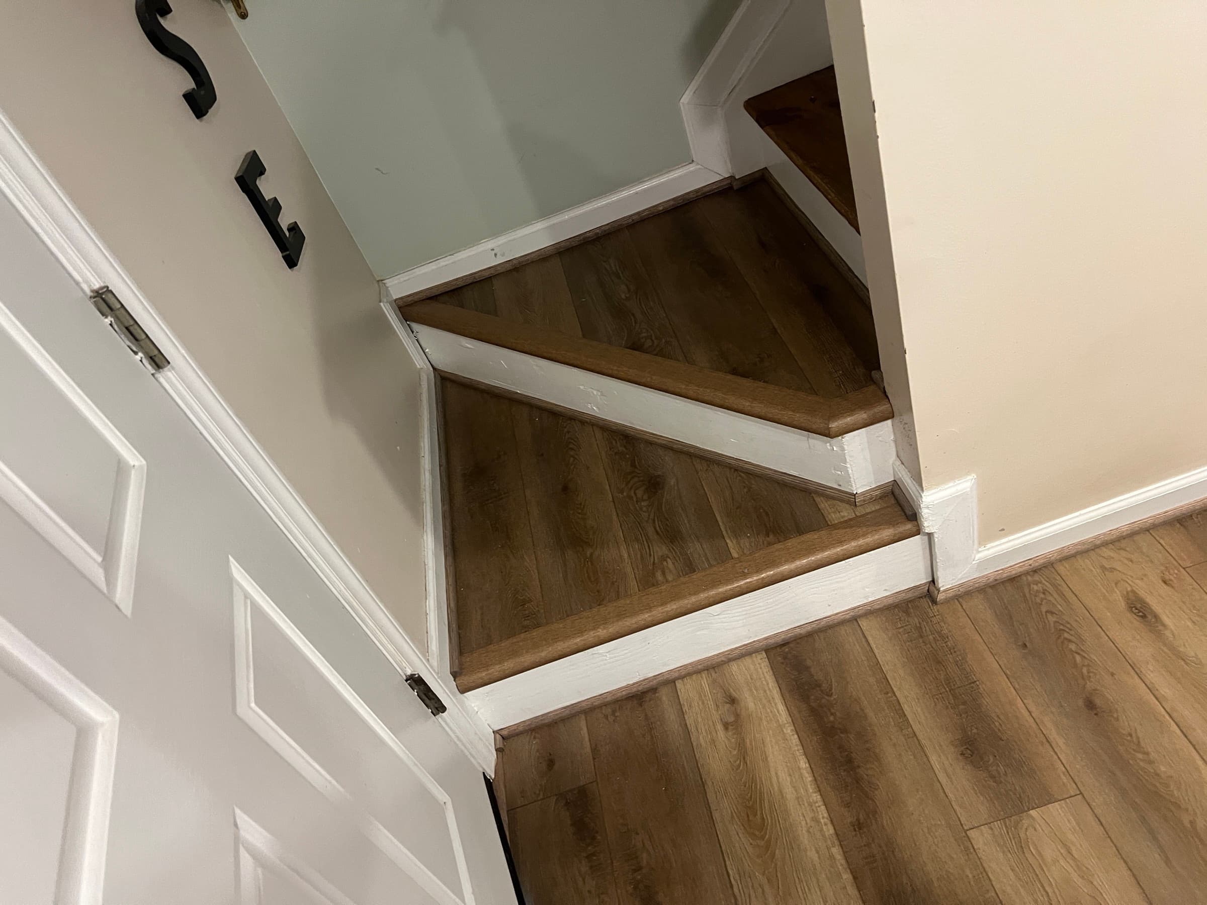 Choice Flooring LVP Vineyard Chardonnay stair treads and risers installed matching main floor in Zebulon NC home