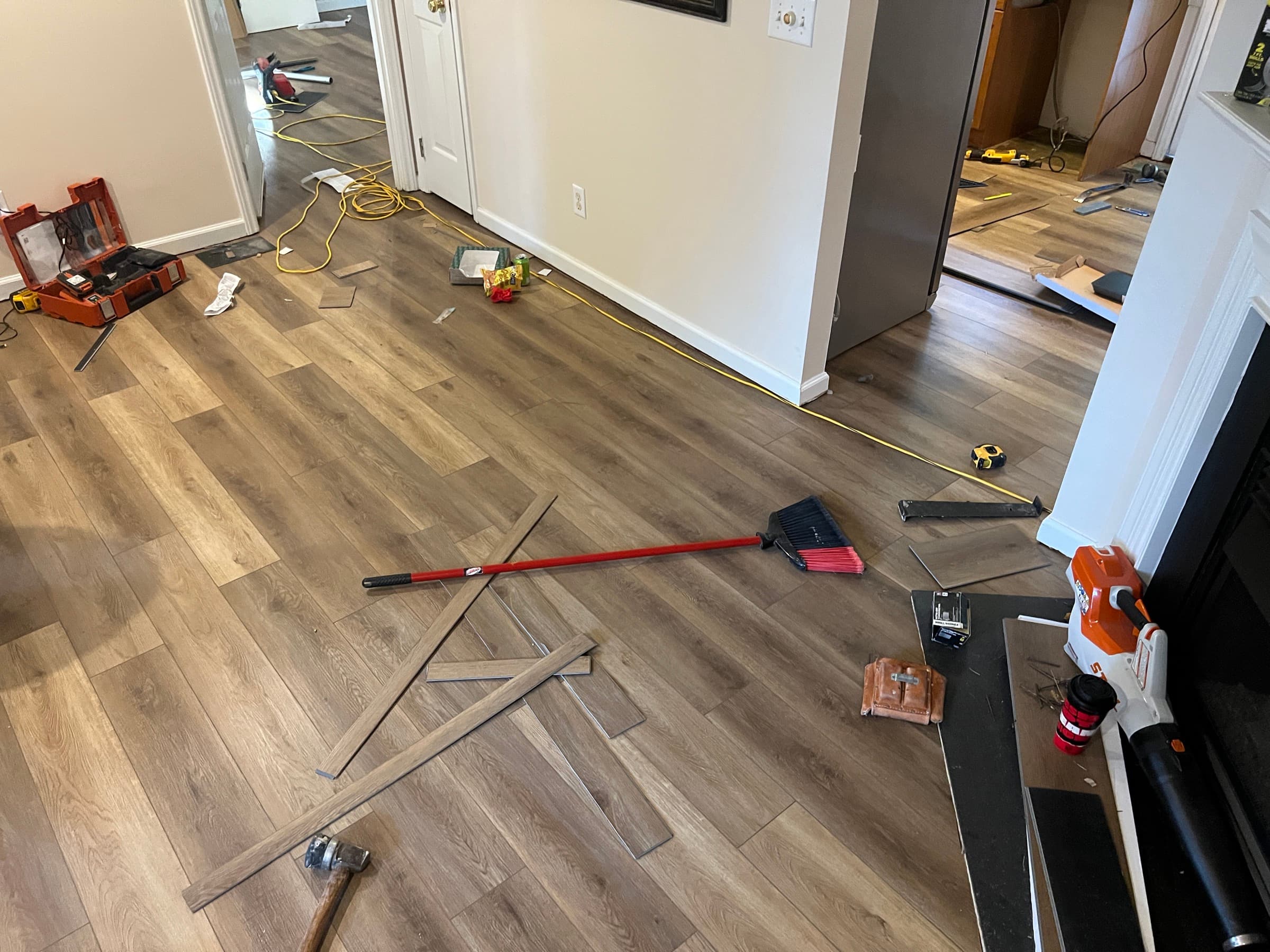 Choice LVP installation in progress throughout main level of Zebulon NC home