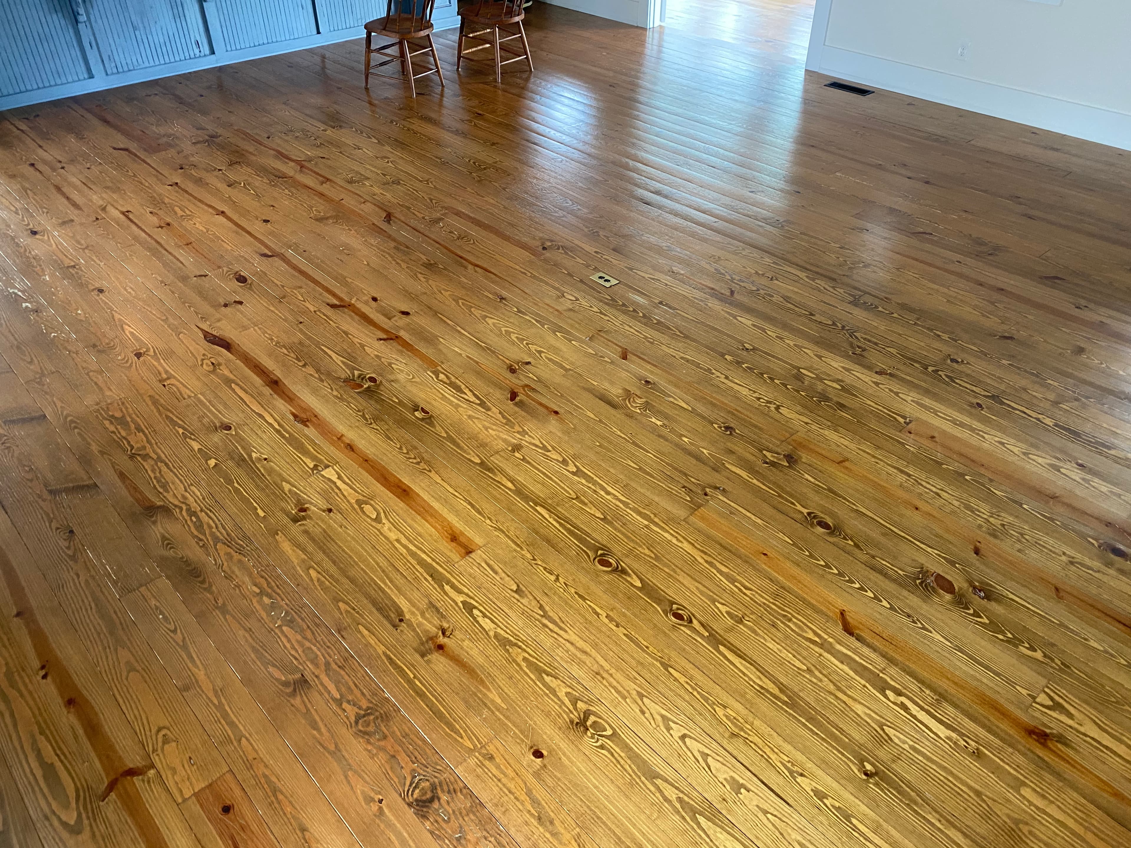 Yellow pine floor condition before refinishing in Flowers Plantation Clayton NC, damage and worn finish on soft pine boards