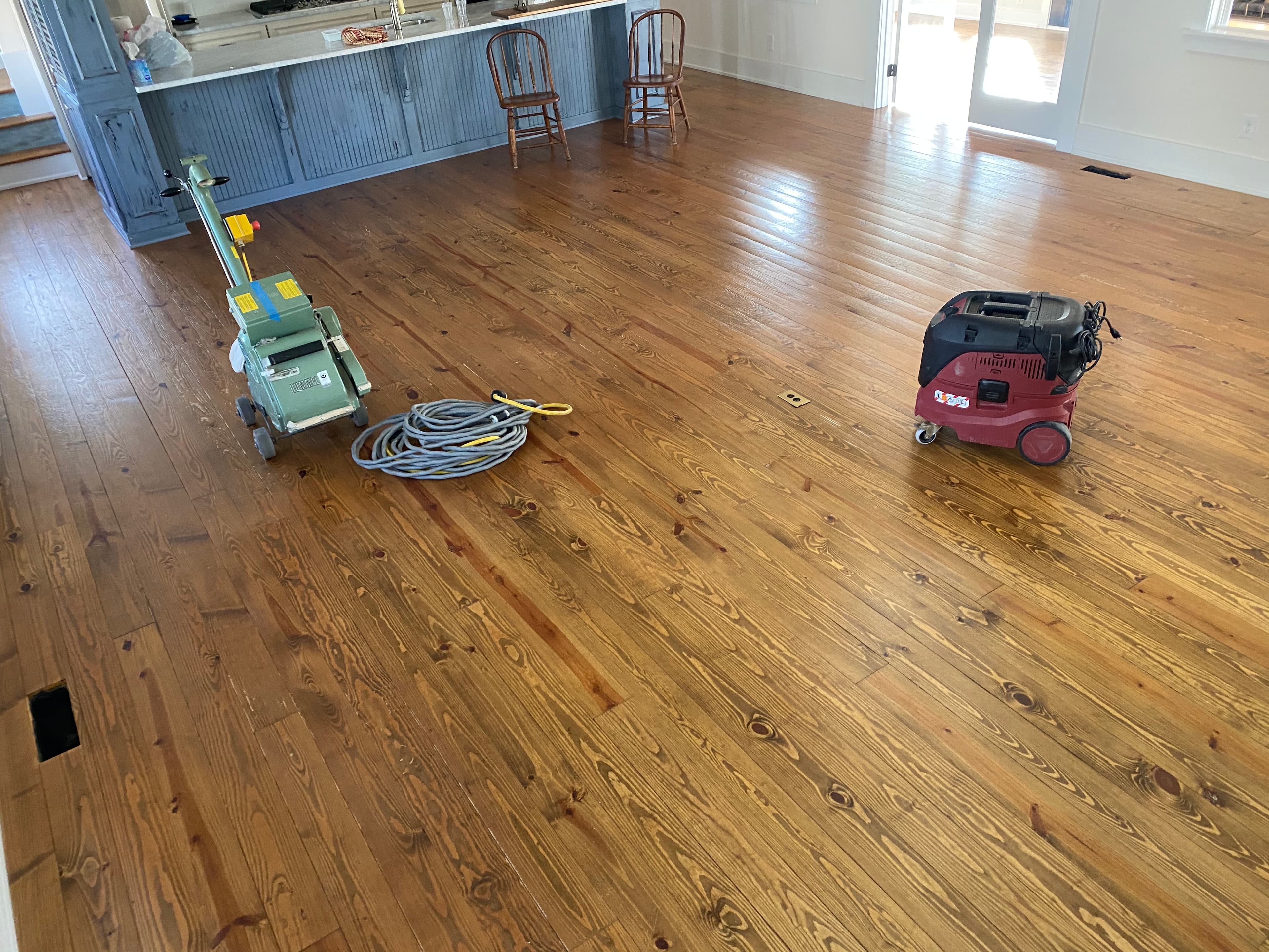 Sanding equipment staged at start of pine floor refinishing in Flowers Plantation Clayton NC Oglethorpe Drive