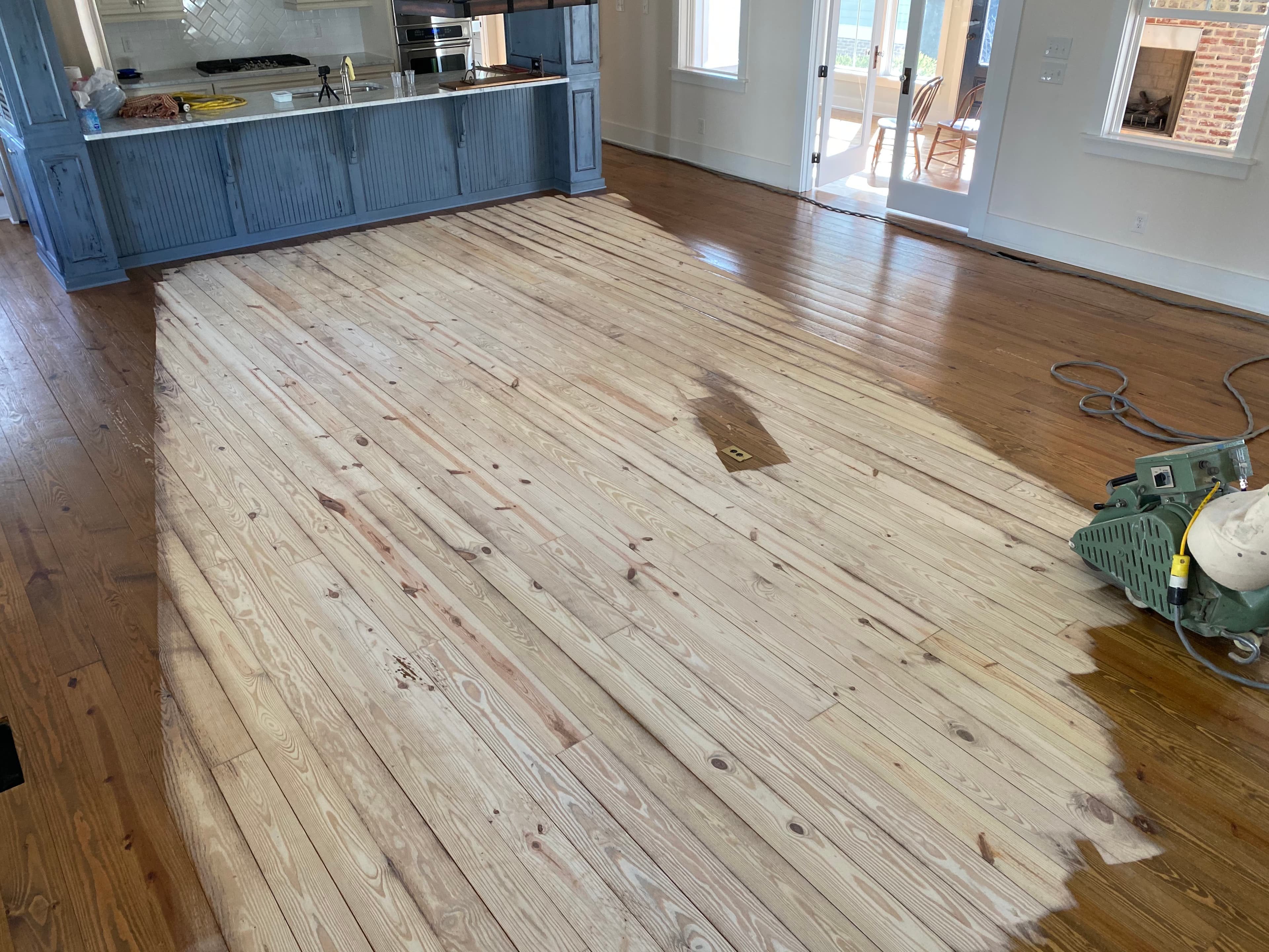 Lagler Hummel drum sander running at angle cut across wide pine floors in Flowers Plantation Clayton NC