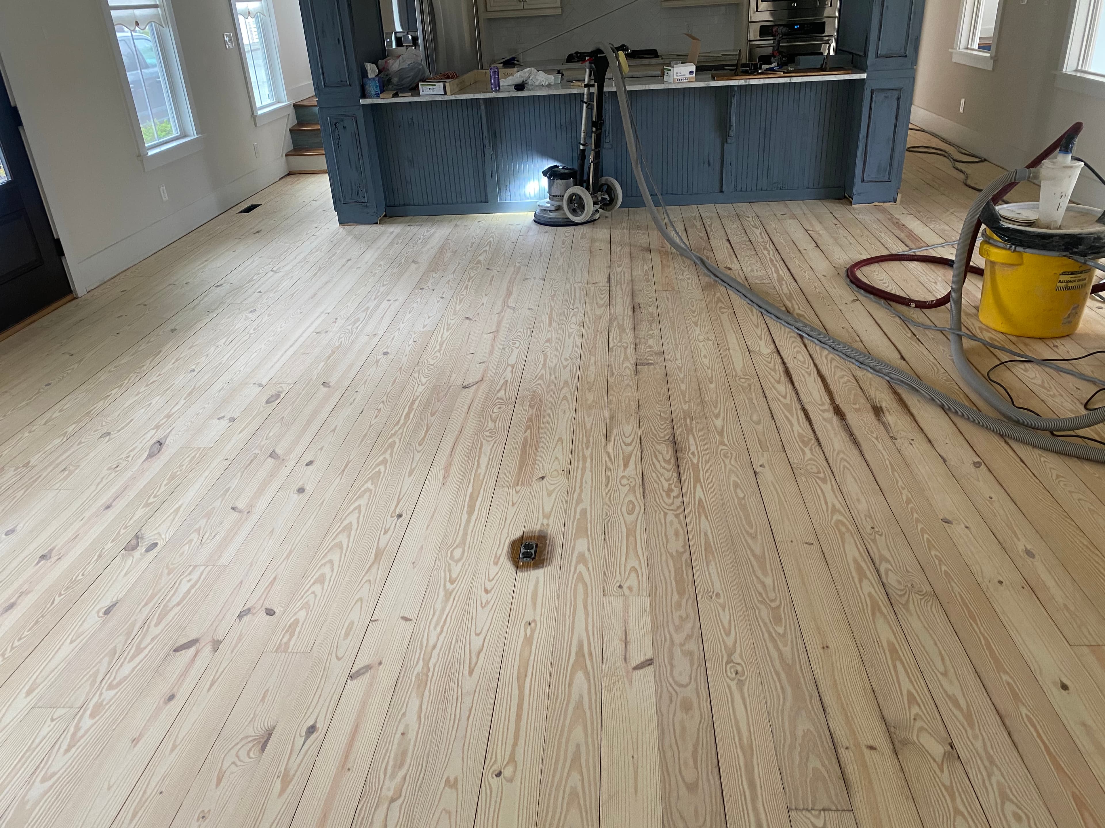 Side by side comparison of Lagler Hummel versus Bona PowerDrive results on wide pine floor in Flowers Plantation Clayton NC