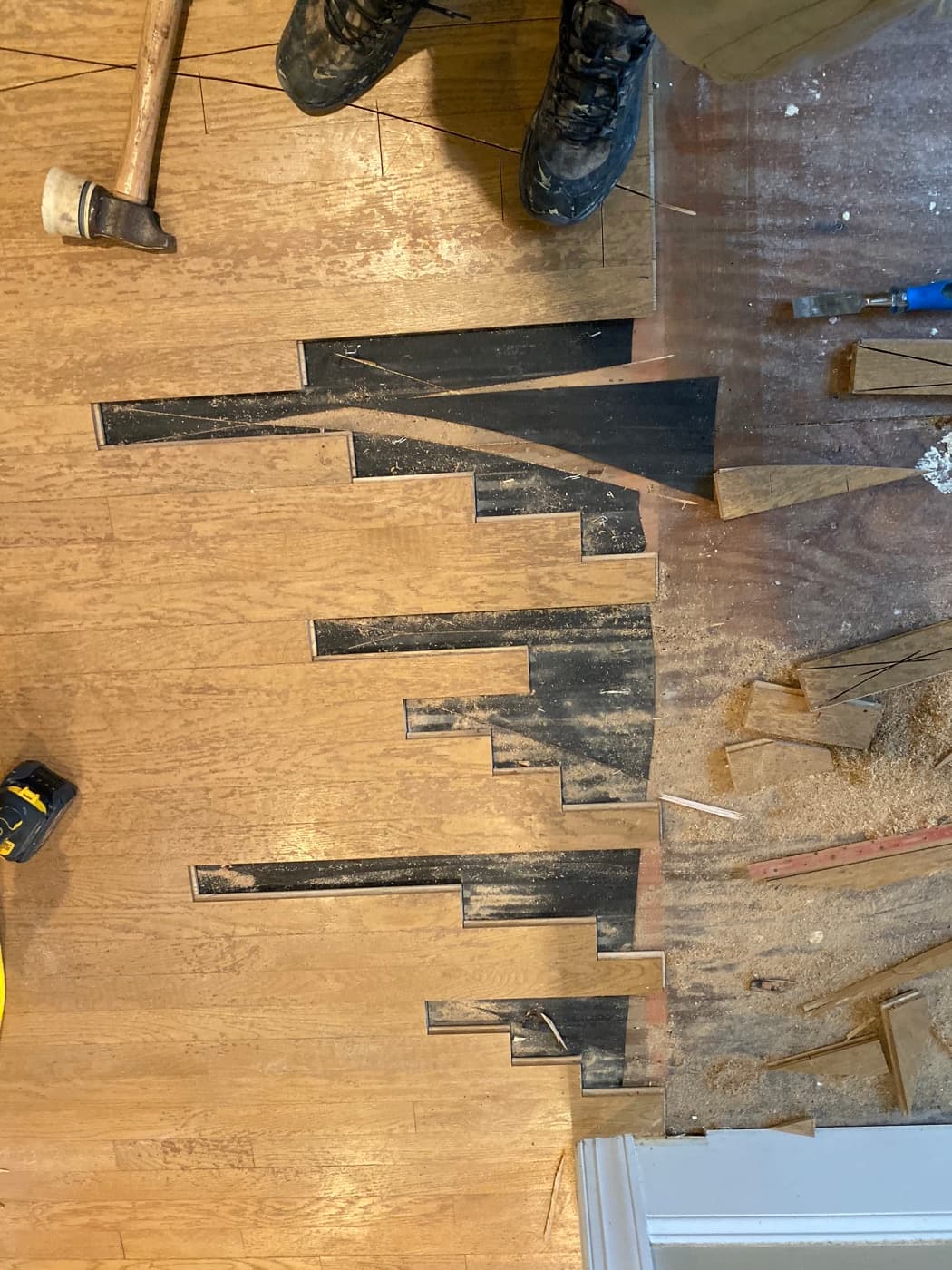 Lace-in cut pattern on red oak hardwood during installation in Glen Laurel Clayton NC