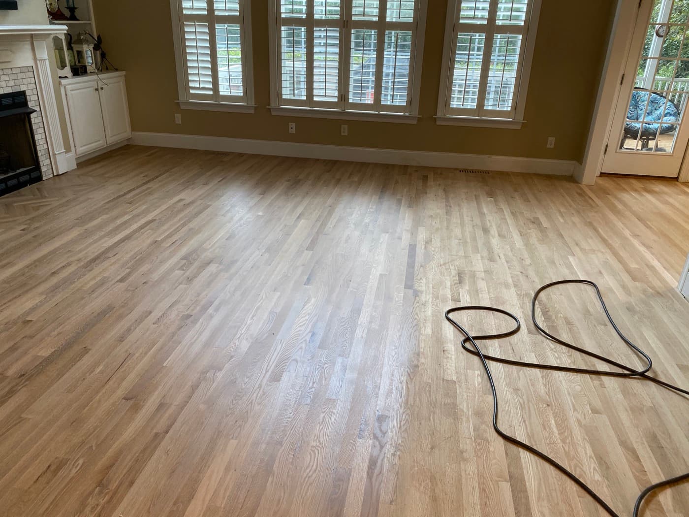 Water popping and hardwax oil application on red oak floors in family room Glen Laurel Clayton NC
