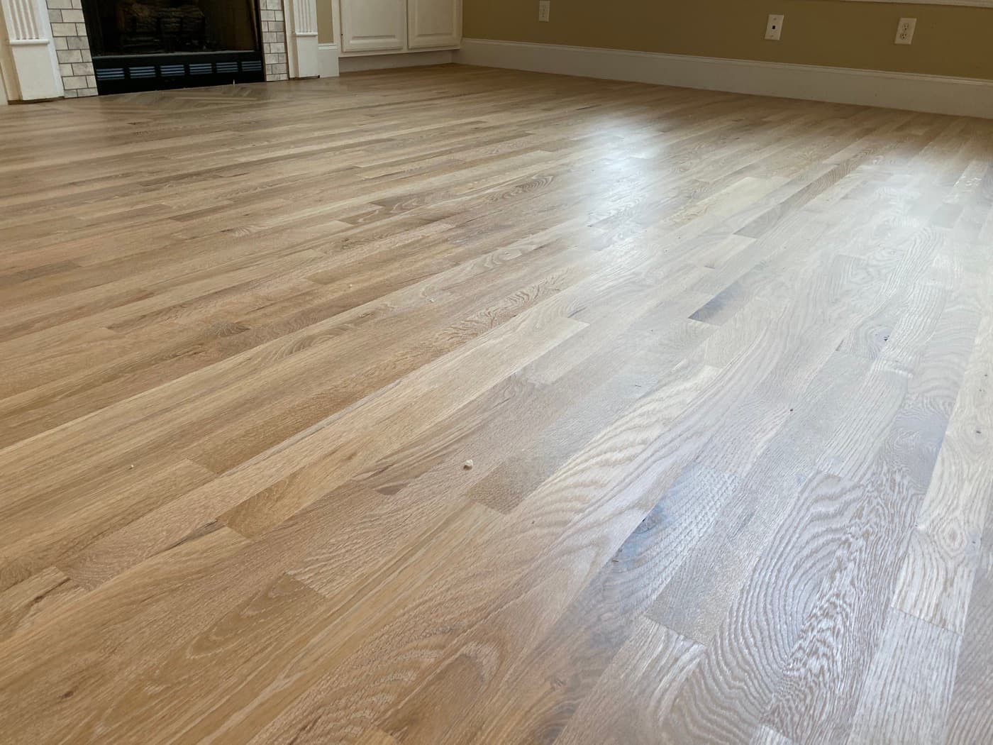 Wide view of finished red oak hardwood floors with natural hardwax oil across main level Glen Laurel Clayton NC