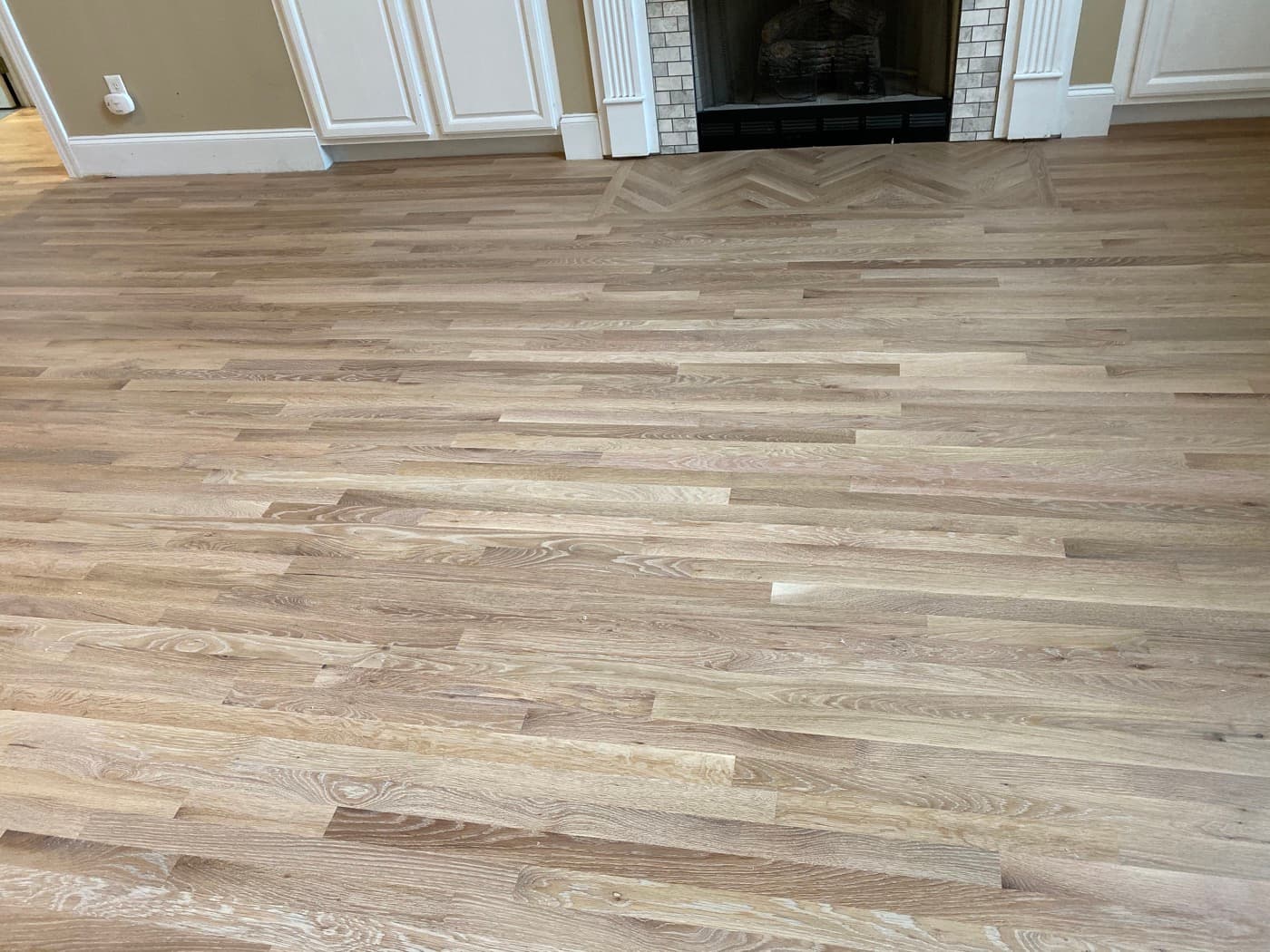Red oak herringbone pattern at fireplace hearth finished with natural hardwax oil in Glen Laurel Clayton NC