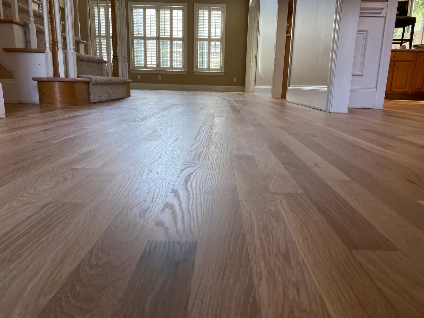 Open floor plan with finished red oak hardwood floors natural hardwax oil Glen Laurel Clayton NC