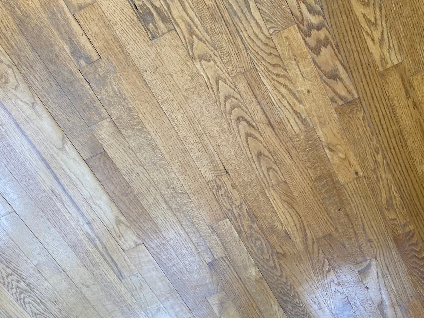 Existing 2.25-inch red oak floors showing drum stop marks from previous inexperienced sanding contractor at Sunset Lakes Fuquay-Varina NC