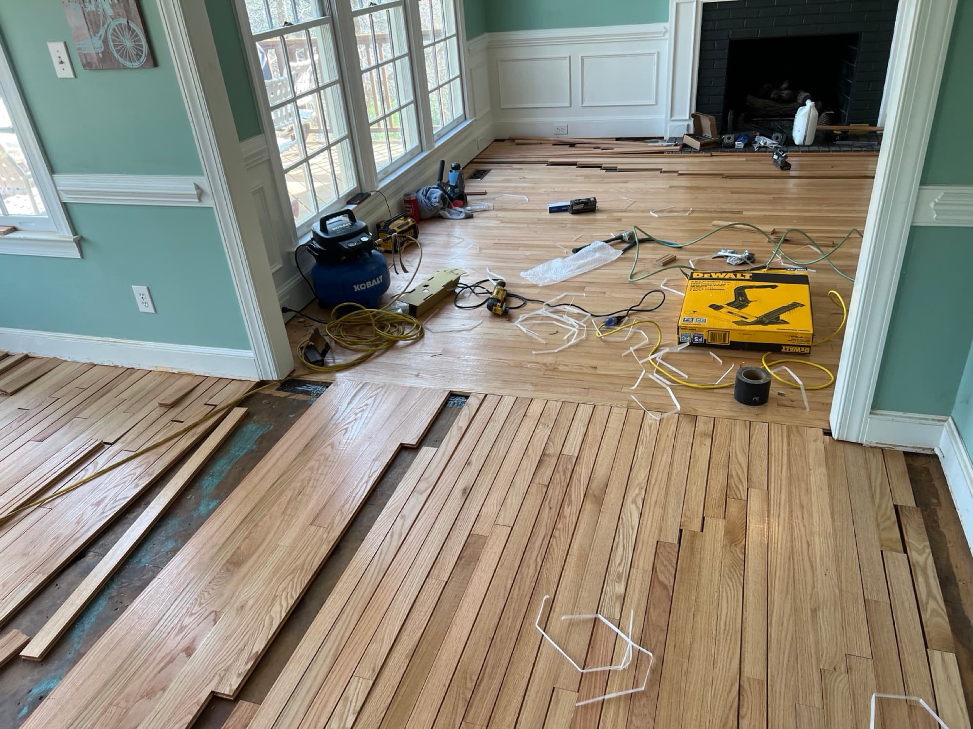 Red oak hardwood floor installation in progress in Raleigh NC, Primatech nailer, Ten Oaks lumber