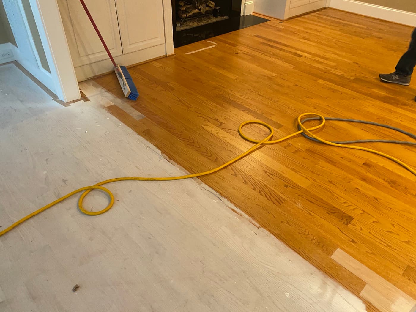 Lace-in installation starting in family room, new red oak boards going down next to existing finished hardwood in Crabtree Heights Raleigh NC