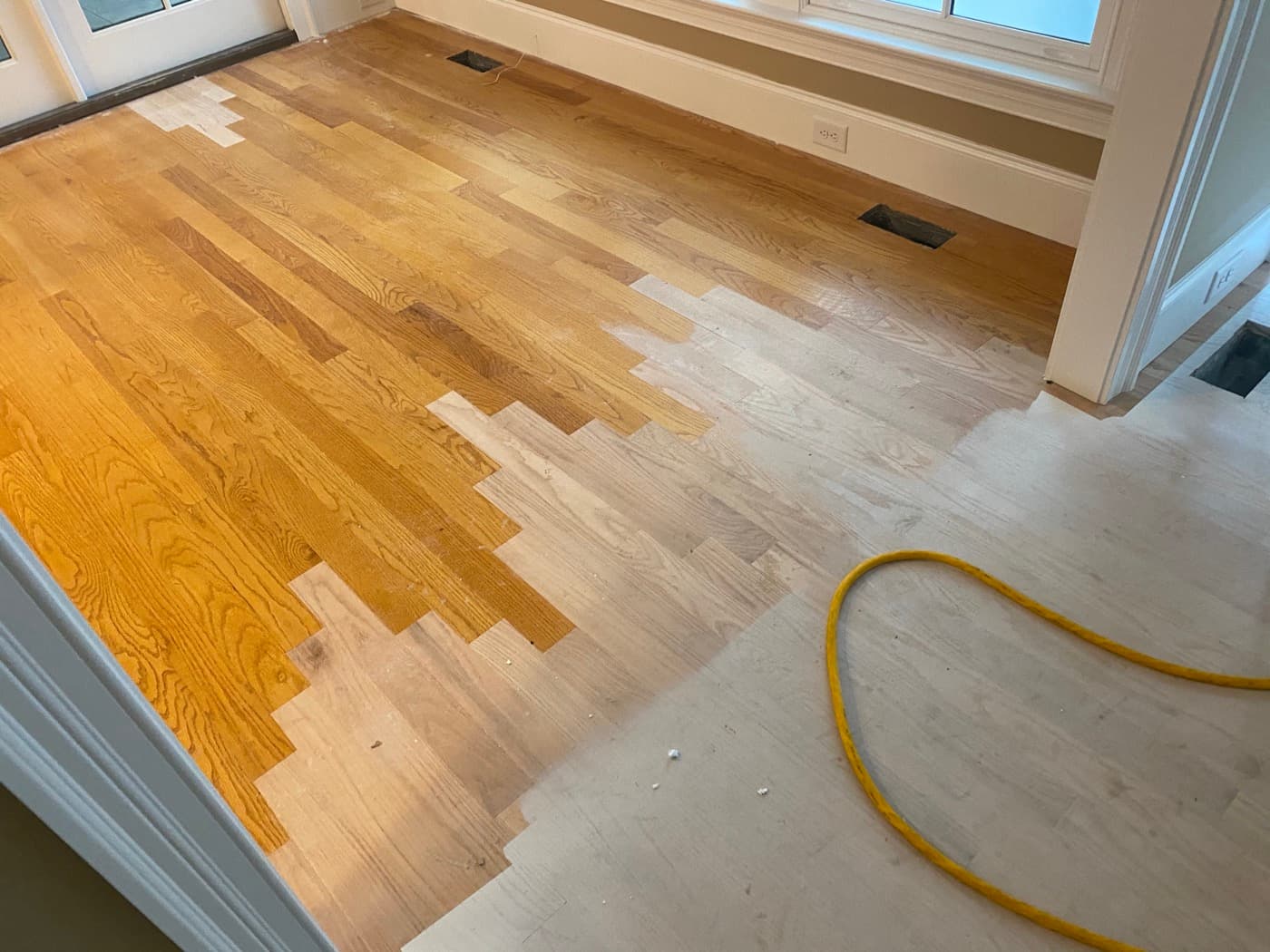 Lace-in cut pattern showing new and existing 3.25-inch red oak boards woven together in Crabtree Heights Raleigh NC