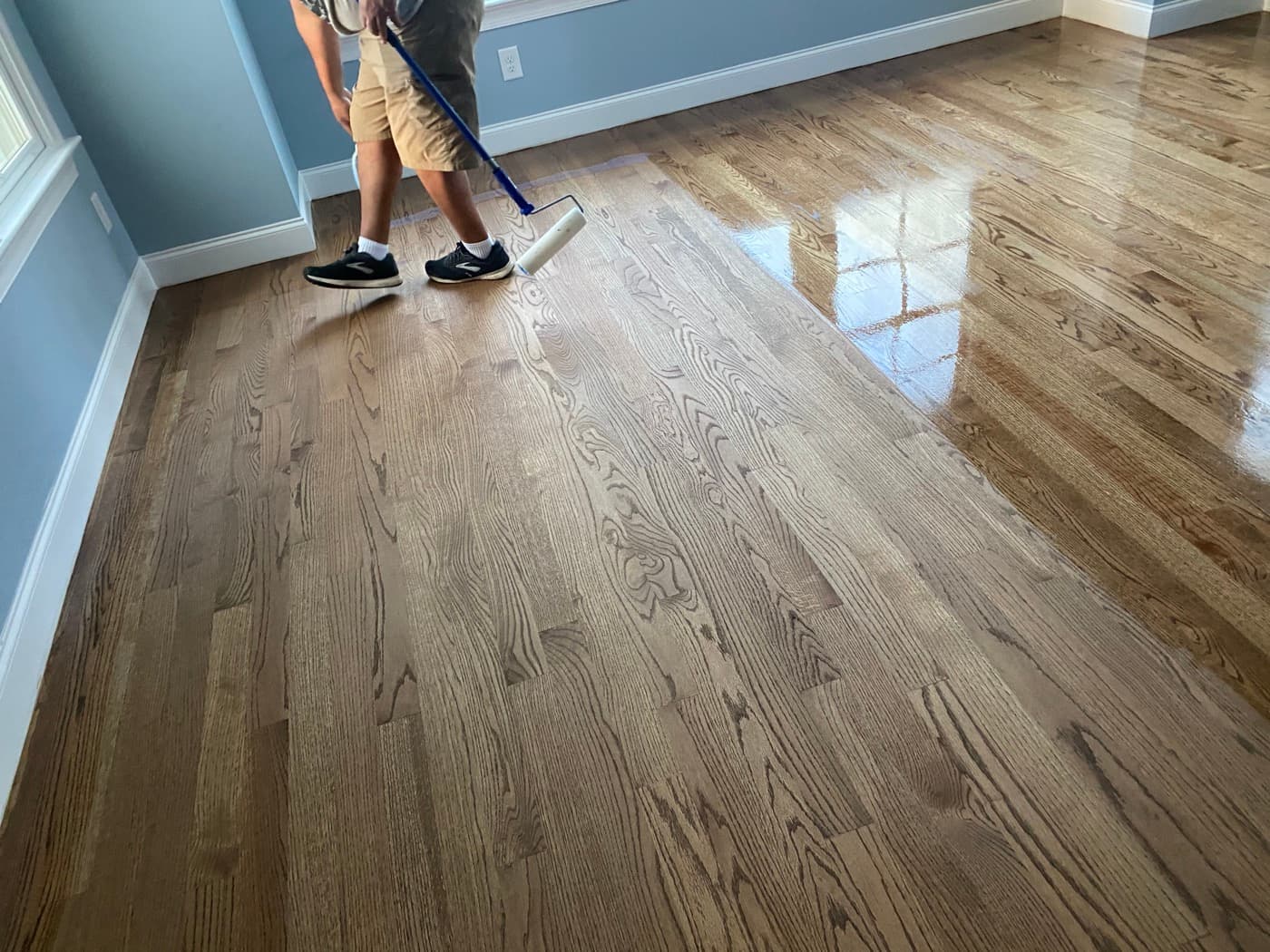 Applying Bona Traffic HD final coat on DuraSeal Special Walnut stained 3.25-inch red oak floors in Crabtree Heights Raleigh NC