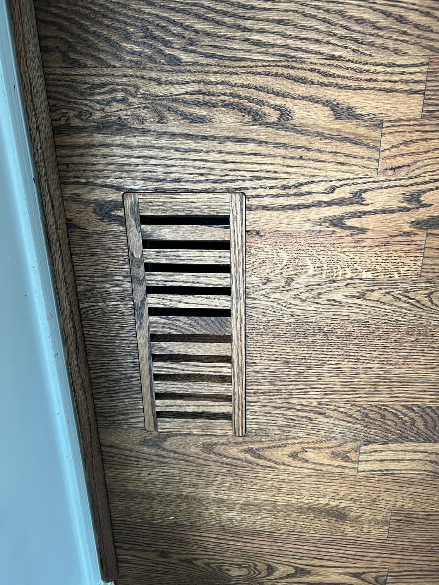 Flush mount floor vent installation in new red oak hardwood floor in Smithfield NC