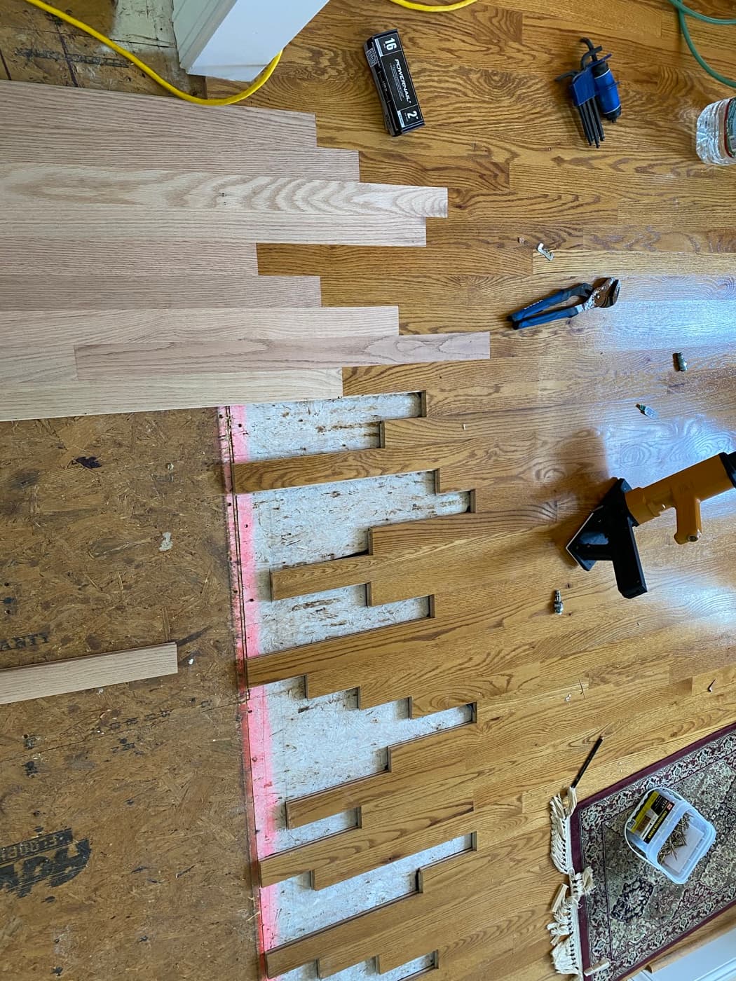 Red oak hardwood lace-in installation in progress at Tanner's Creek Wendell NC