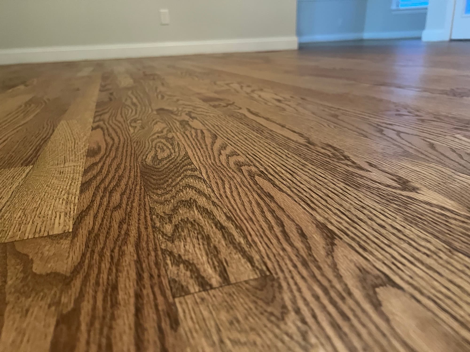 Close-up grain detail of finished red oak floor with custom Berger Seidle hardwax oil blend in Summerset Place Clayton NC