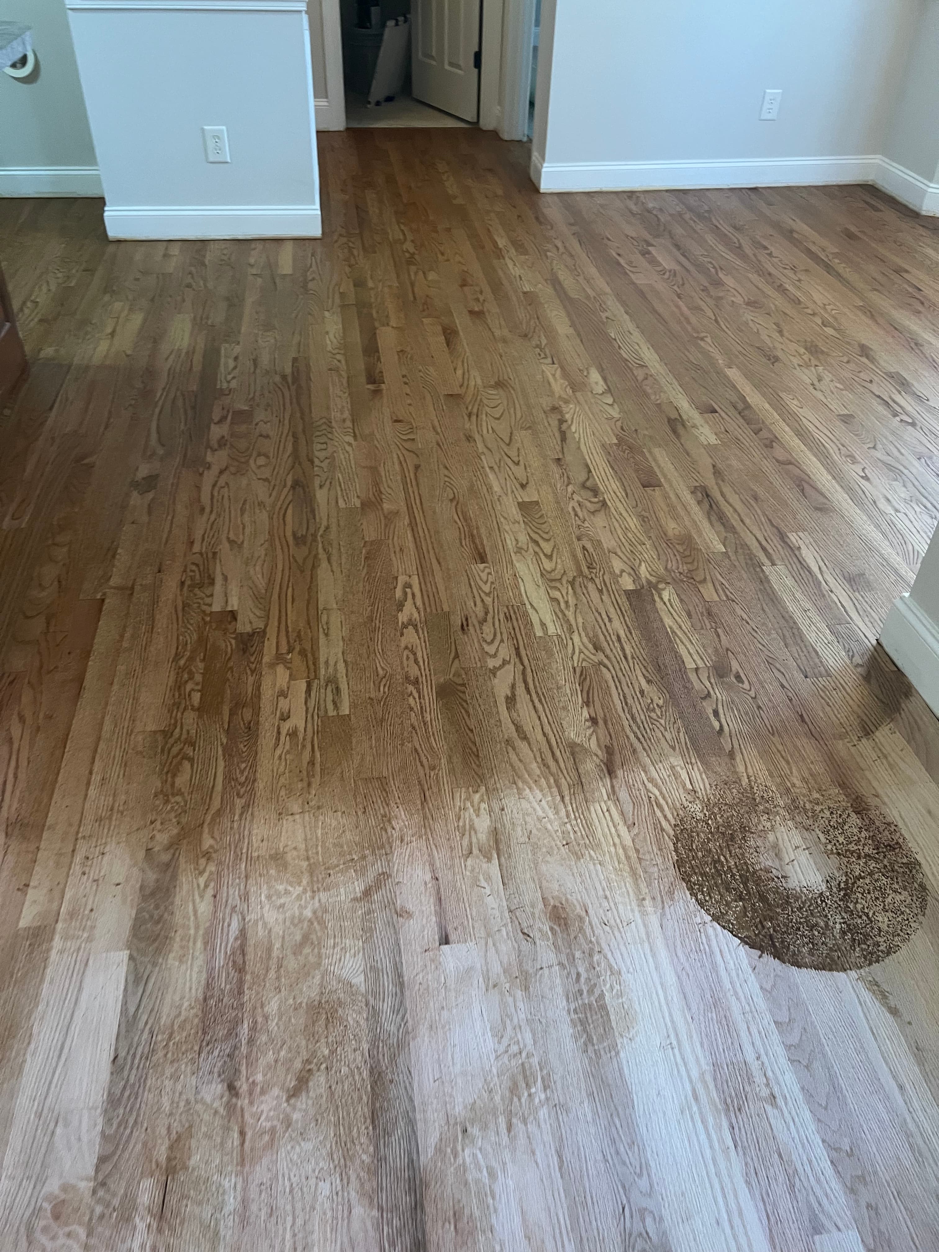 Red oak floor mid-sanding in Summerset Place Clayton NC, lace-in area being blended with Lagler Hummel drum sander