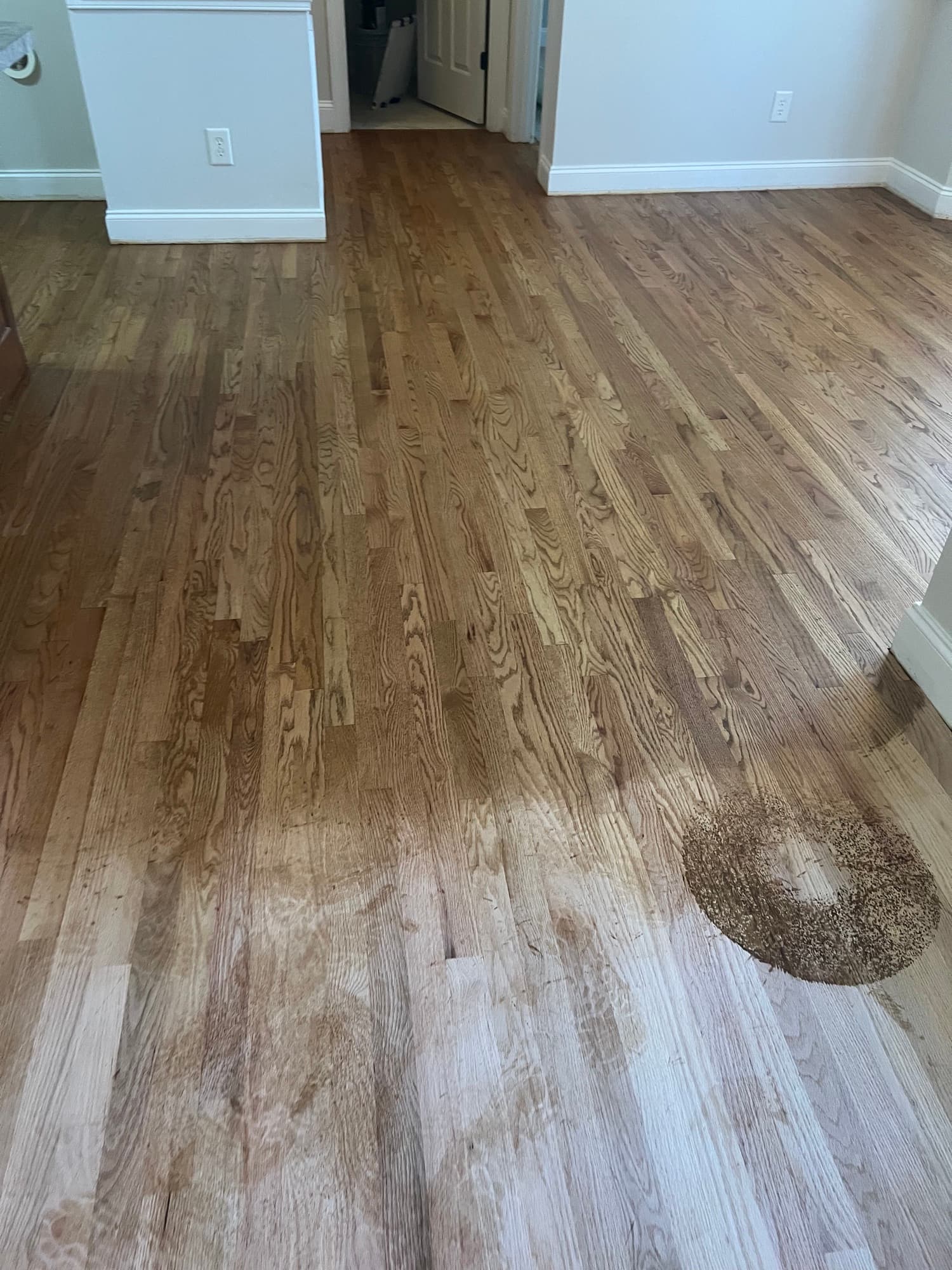 Red oak floor mid-sanding in Summerset Place Clayton NC, lace-in area being blended with Lagler Hummel drum sander