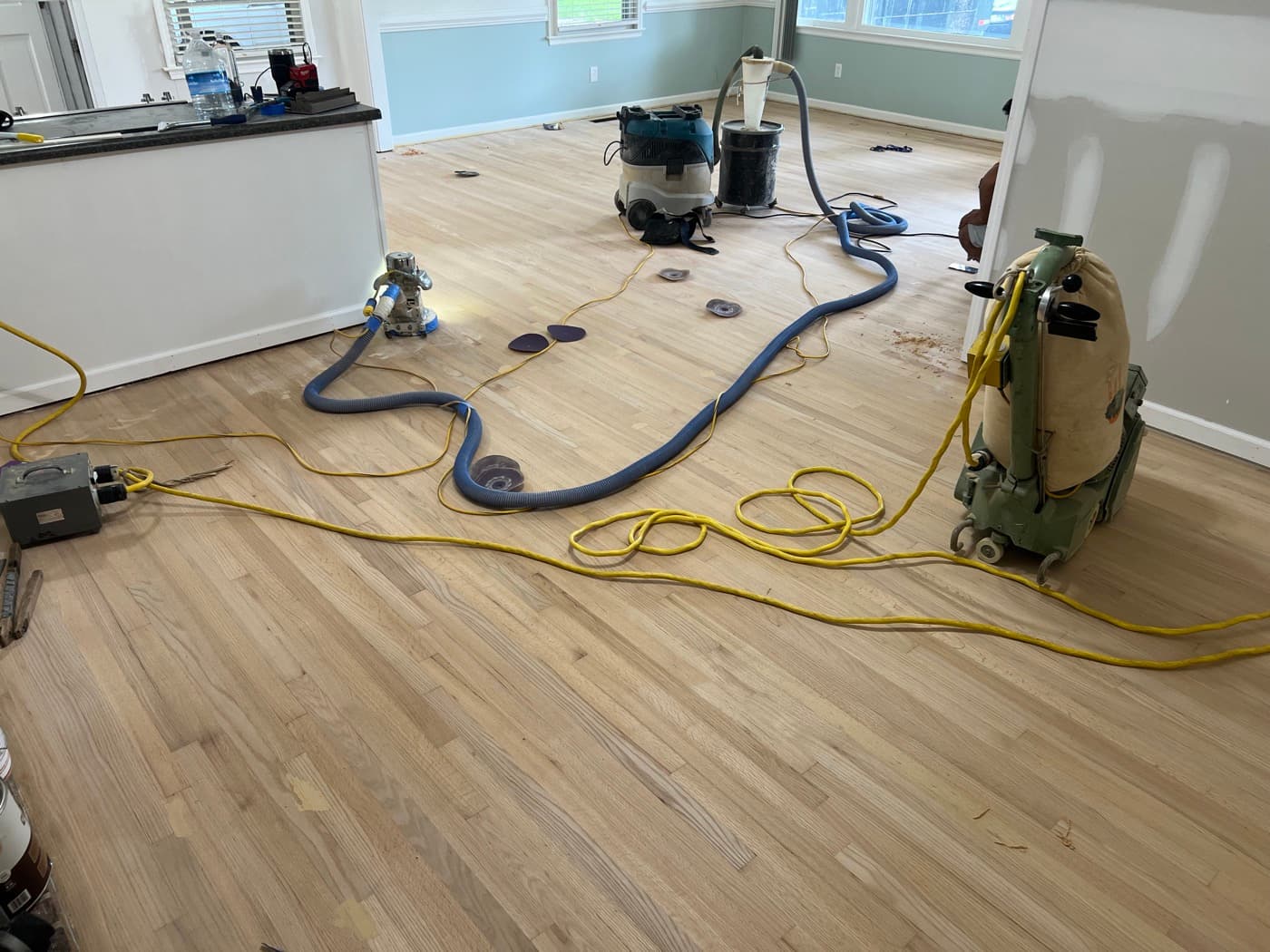 Lagler Hummel drum sander and equipment during field sanding of red oak floors in Knightdale NC