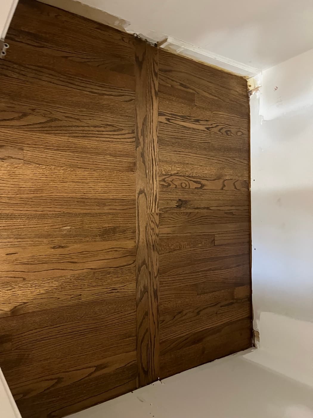 Finished closet floor with DuraSeal Provincial stain after repair and refinishing in Knightdale NC