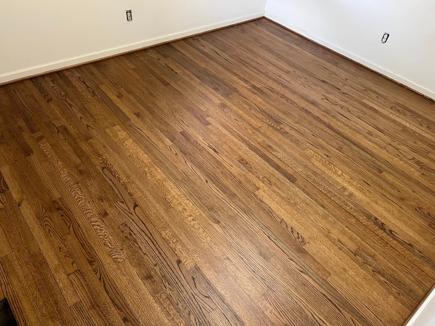 Finished red oak bedroom floor with DuraSeal Provincial stain and Bona Mega One in Knightdale NC