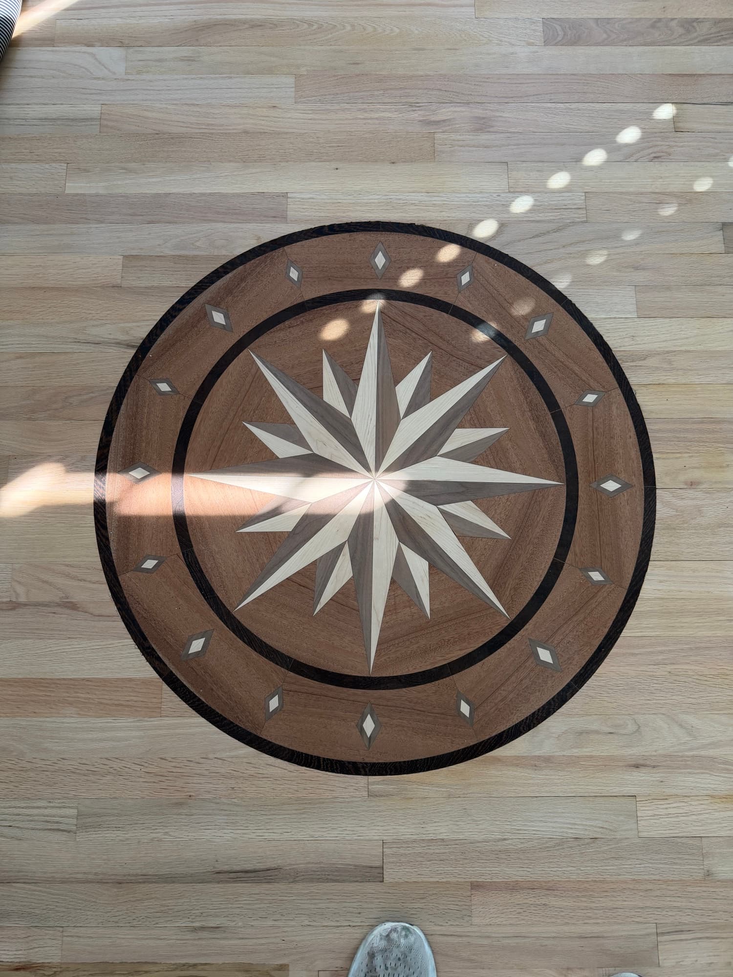 Compass rose hardwood floor medallion in walnut maple and wenge, finished with Bona Mega One natural satin in Glen Laurel Clayton NC